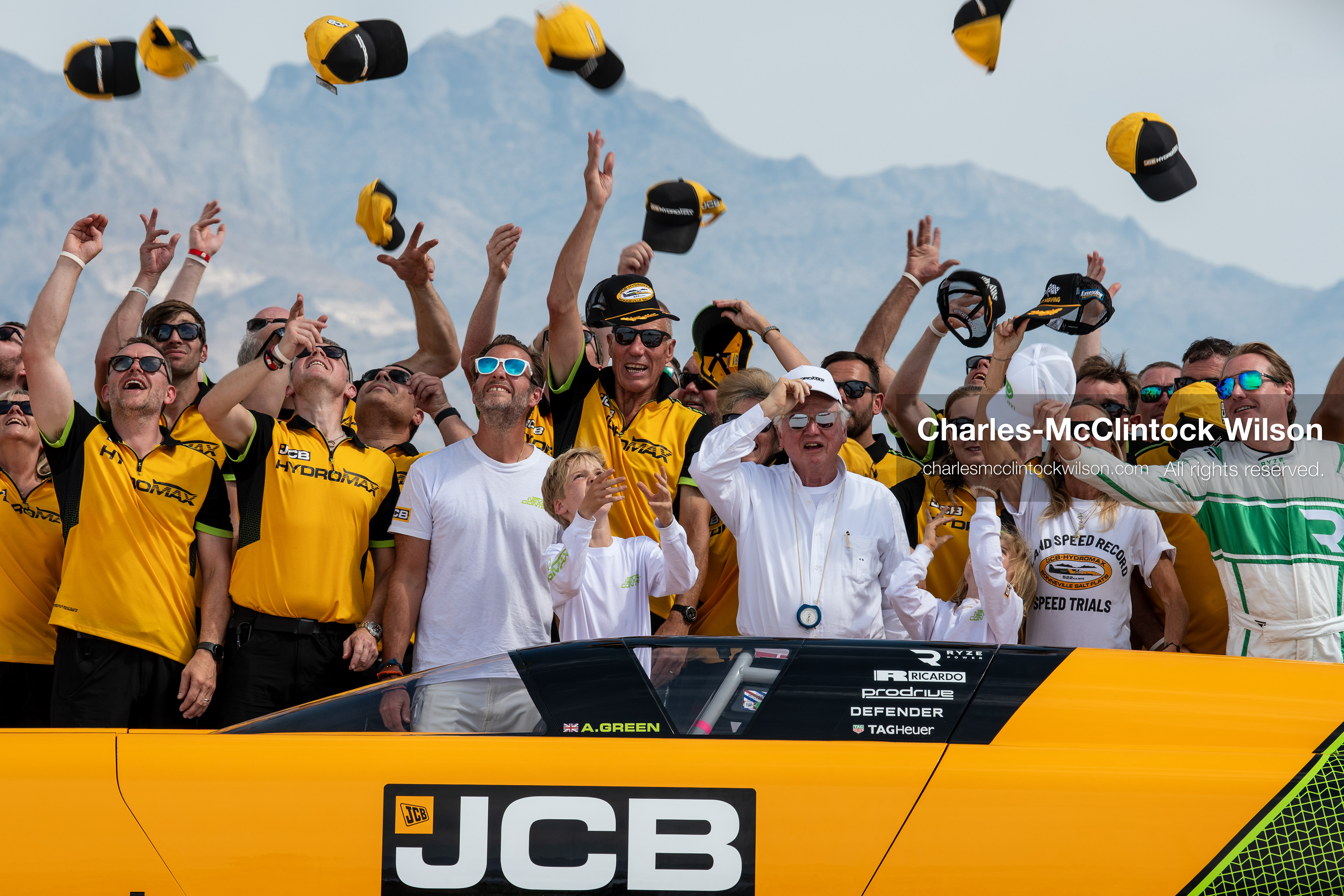 August 11, 2026, Wendover, Utah, USA: British pilot Andy Green, JCB Chairman Anthony Bamford, and members of the JCB engineering team throw their hats into the air behind the cockpit of the ''JCB Hydromax'' on the Bonneville Salt Flats on Tuesday. The team celebrated setting a new hydrogen land speed record of 406.320 mph. (Credit Image: © Charles McClintock Wilson/ZUMA Press Wire)