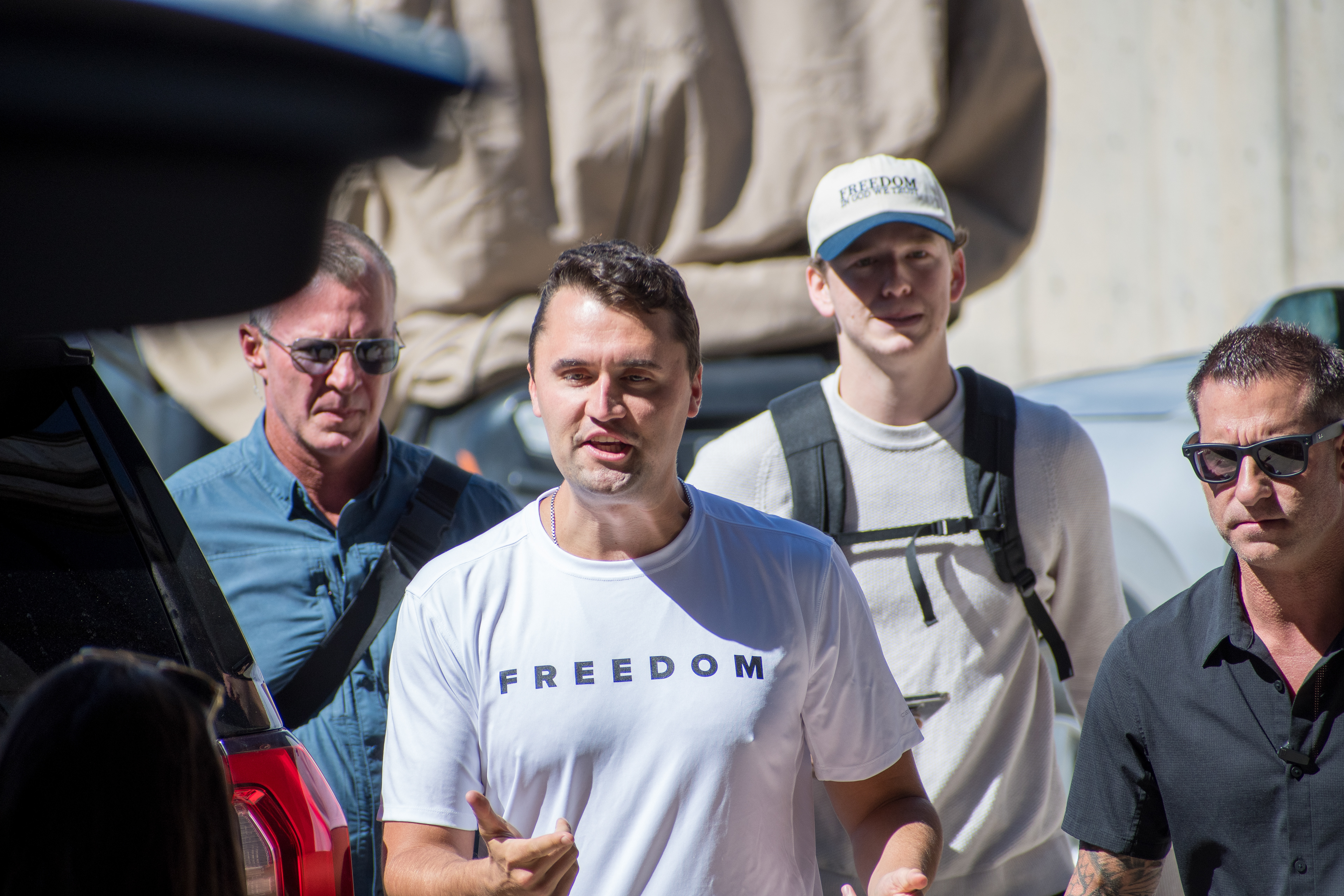 OREM, UTAH – SEPTEMBER 10, 2025: Charlie Kirk arrives at Utah Valley University for a scheduled public event. Wearing a shirt emblazoned with the word “FREEDOM,” Kirk walks among supporters and staff in a moment of visible anticipation. The image marks the beginning of his final public appearance, capturing the atmosphere of civic energy and symbolic presence that defined the day. © Charles-McClintock Wilson / ZUMA Press