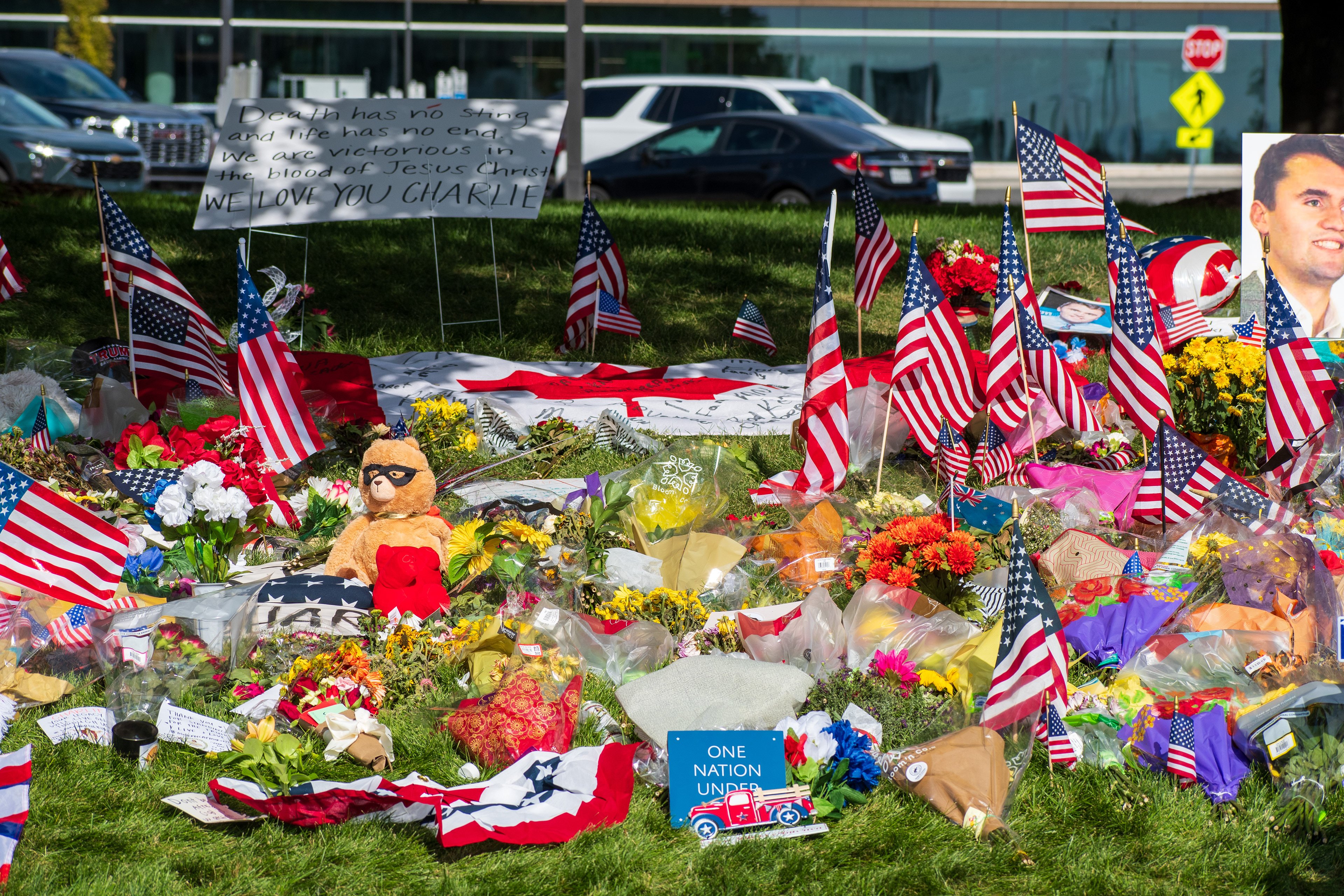 OREM, UTAH – SEPTEMBER 15, 2025: A memorial honoring Charlie Kirk is seen on the campus of Utah Valley University, featuring American flags, candles, flowers, and handwritten signs arranged around a large portrait. The tribute appeared days after Kirk’s final public event at the university. © Charles‑McClintock Wilson / ZUMA Press
