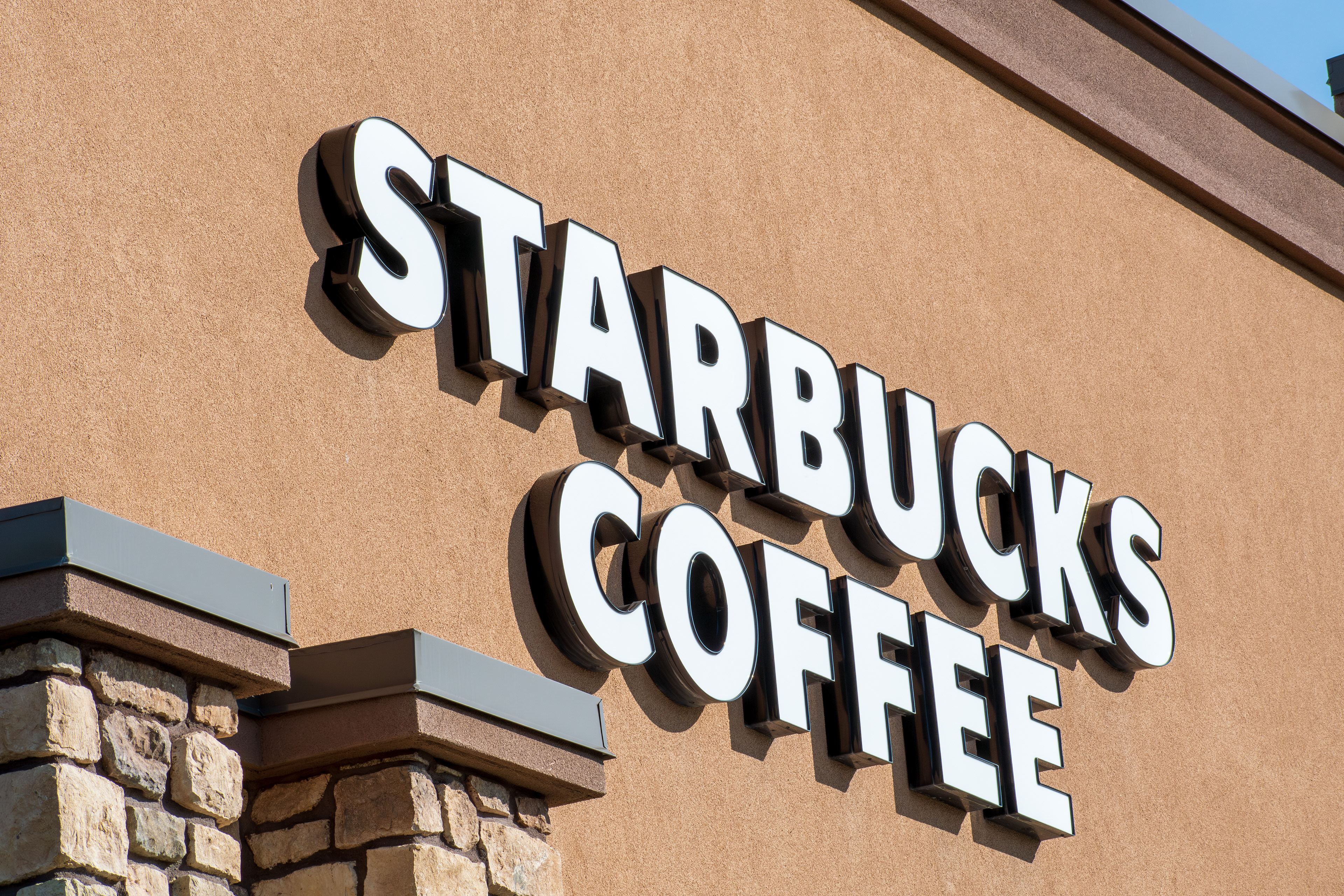 SPANISH FORK, UT, USA - JUNE 09, 2025: Exterior view of Starbucks logo sign. Starbucks is an American multinational chain of coffeehouses and roastery reserves headquartered in Seattle, Washington.