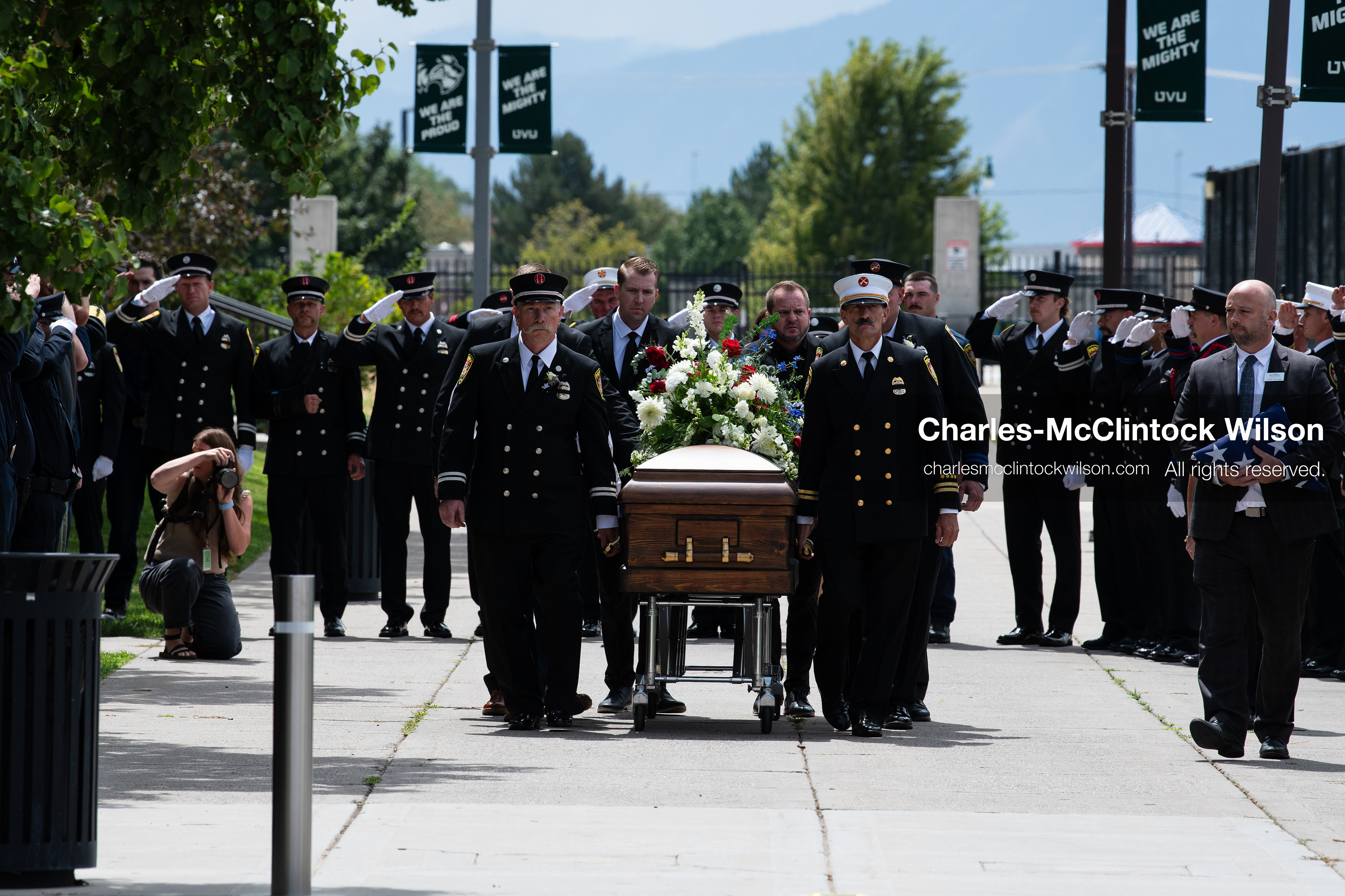 Firefighters and pallbearers escort the casket of Provo Fire Captain Spencer Long outside the UCCU Center on the campus of Utah Valley University in Orem, Utah, on Wednesday, July 29, 2026. More than 300 people came to the public memorial ceremony to honor Captain Long, his wife Katrina, and three of their sons, who died after a flash flood hit their campsite near the Sunglow Campground in Wayne County. (Photo by Charles-McClintock Wilson/Sipa USA)