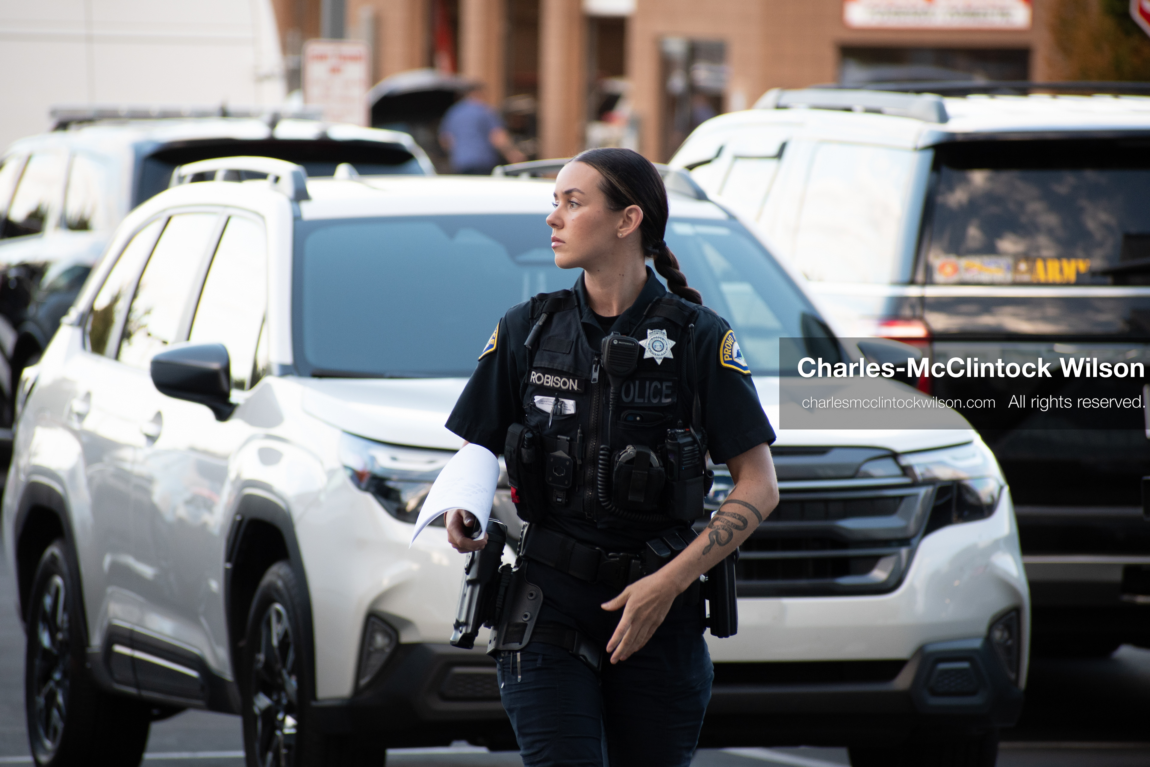 SEPTEMBER 29, 2025 — PROVO, UTAH, USA: A Provo Police Department officer walks outside the Utah County Court during a waiver hearing for Tyler Robinson. Robinson, charged with aggravated murder in the September 10 shooting death of conservative activist Charlie Kirk at Utah Valley University, appeared virtually for the proceedings. Law enforcement maintained a visible presence throughout the hearing. (Credit Image: © Charles‑McClintock Wilson / ZUMA Press Wire)