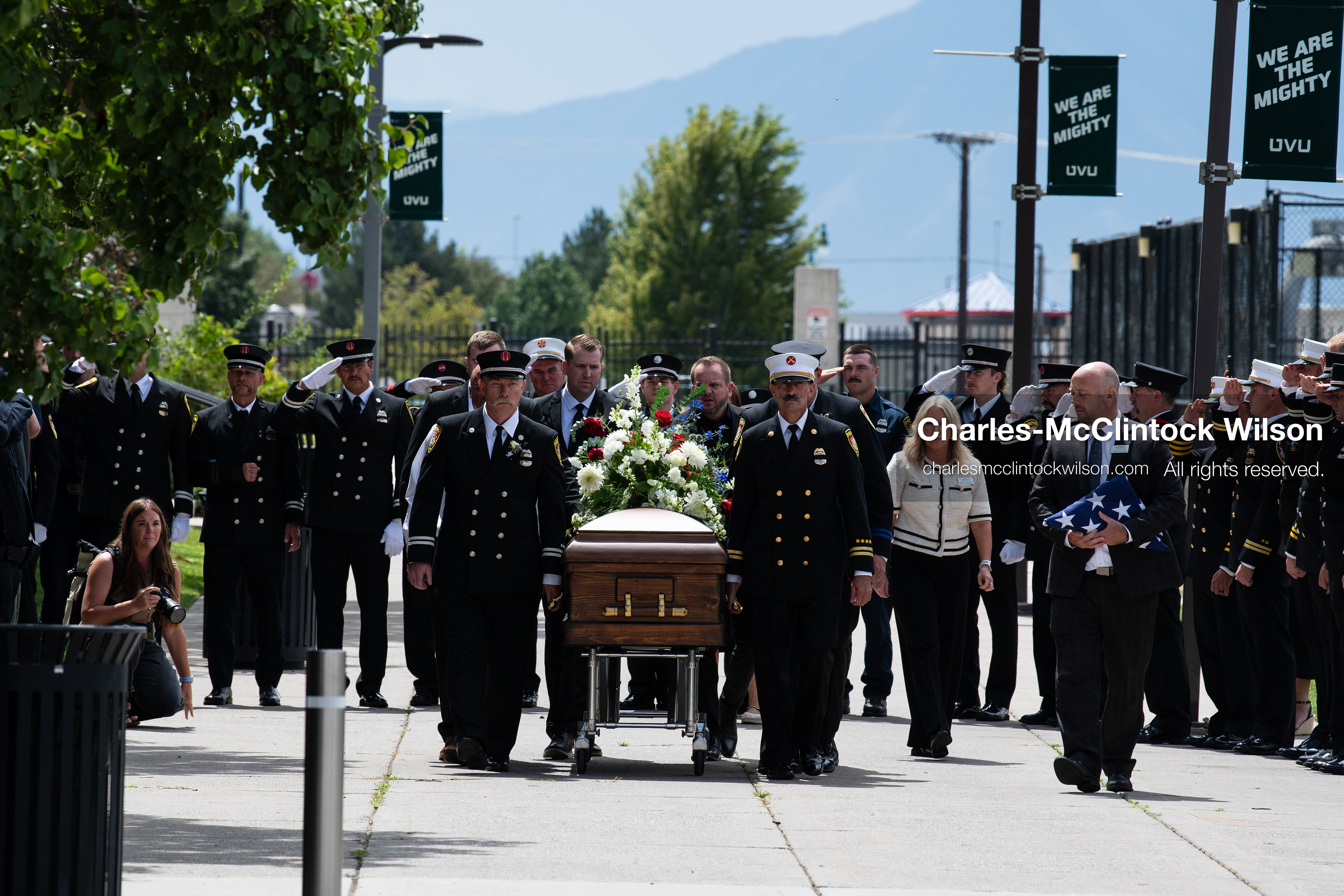 Firefighters and pallbearers escort the casket of Provo Fire Captain Spencer Long outside the UCCU Center on the campus of Utah Valley University in Orem, Utah, on Wednesday, July 29, 2026. More than 300 people came to the public memorial ceremony to honor Captain Long, his wife Katrina, and three of their sons, who died after a flash flood hit their campsite near the Sunglow Campground in Wayne County. (Photo by Charles-McClintock Wilson/Sipa USA)