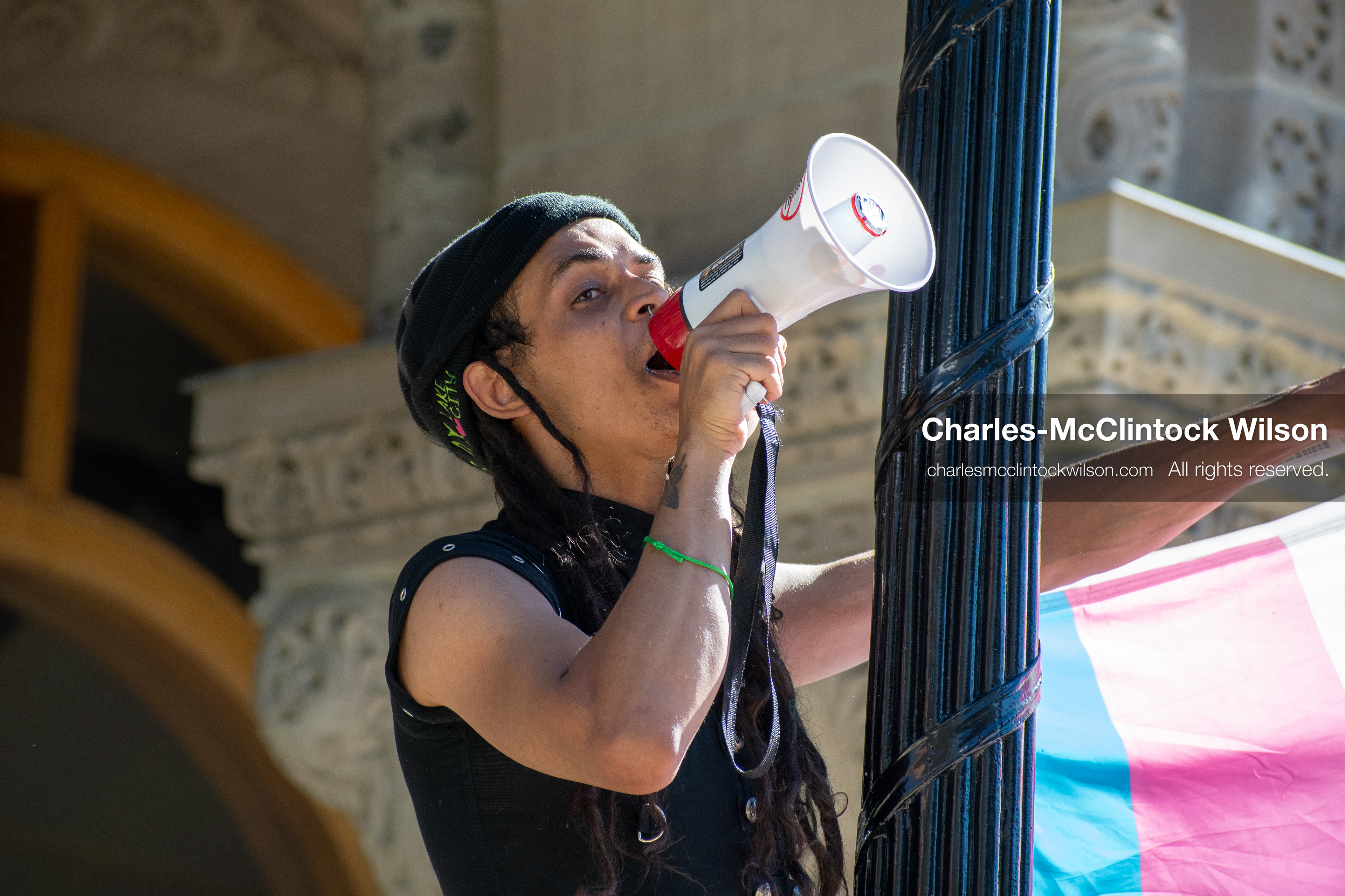 October 18, 2025, Salt Lake City, Utah, USA: A demonstrator speaks through a megaphone during a "No Kings" rally at Washington Square Park in Salt Lake City, Utah. The protest was part of a nationwide mobilization.