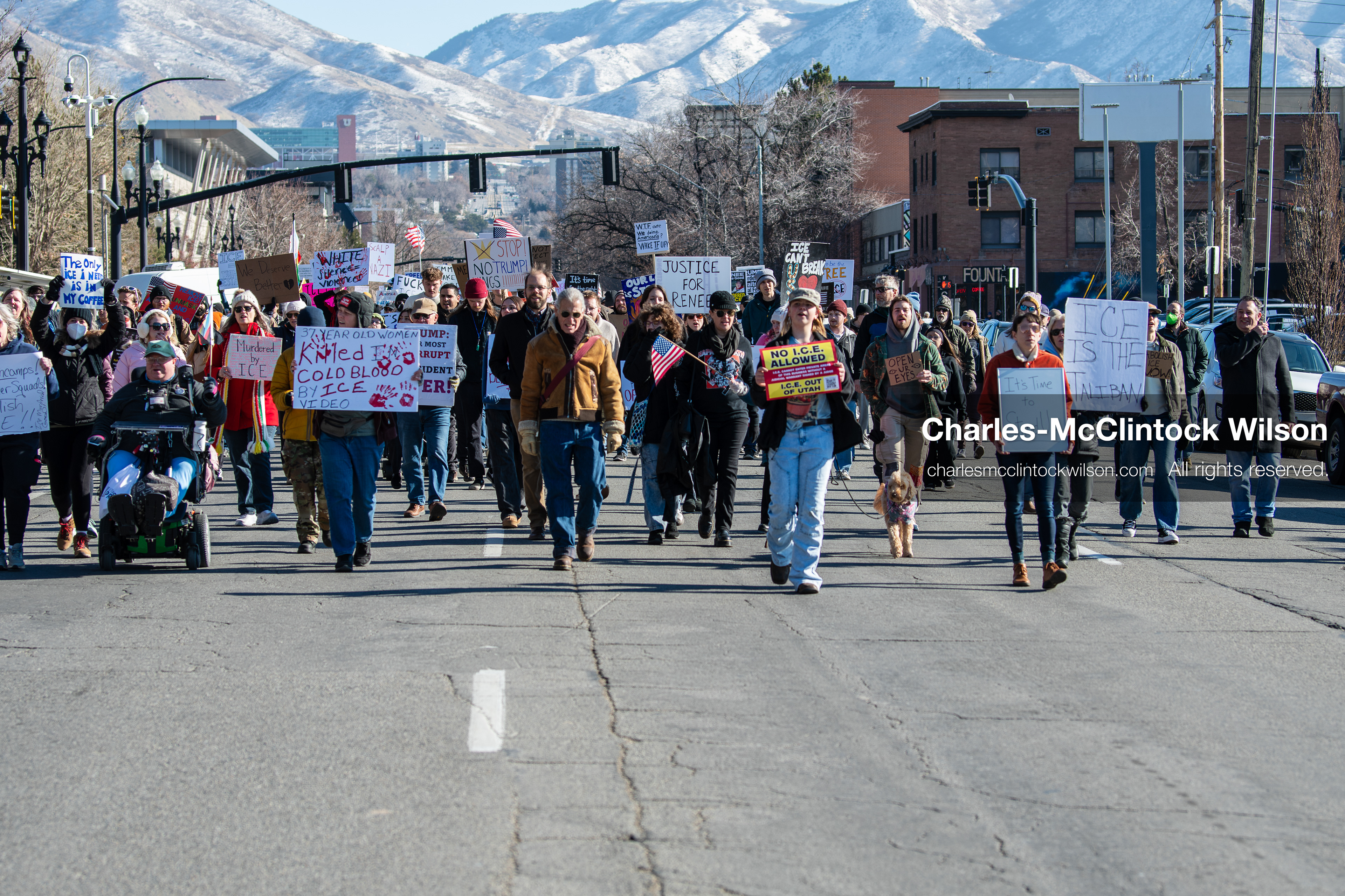Salt Lake City, Utah, January 10, 2026: A group of demonstrators marches through downtown Salt Lake City during the ICE Out for Good protest, which began at Washington Square Park, with participants carrying signs and personal items as they walk together. (Credit Image: © Charles‑McClintock Wilson/ZUMA Press Wire)