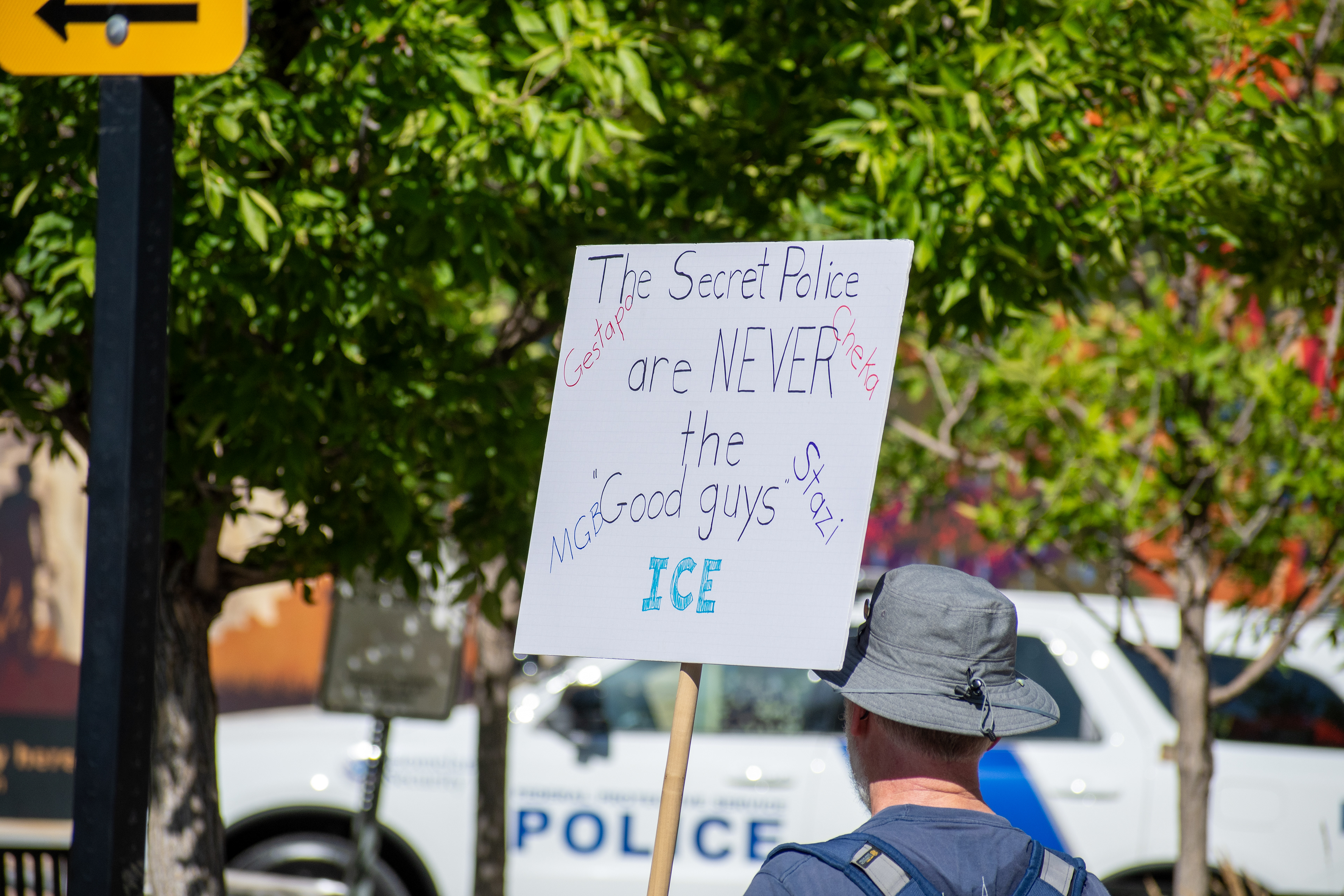 September 15, 2025 – Provo, Utah, United States: A demonstrator holds a sign comparing ICE to historical secret police organizations—including the Gestapo, Cheka, MGB, and Stasi—outside the Utah Valley Convention Center during a protest against the Department of Homeland Security career expo. The message asserts that “The Secret Police are NEVER the Good guys,” invoking historical critique and symbolic resistance. Photograph by Charles‑McClintock Wilson / ZUMA Press Wire