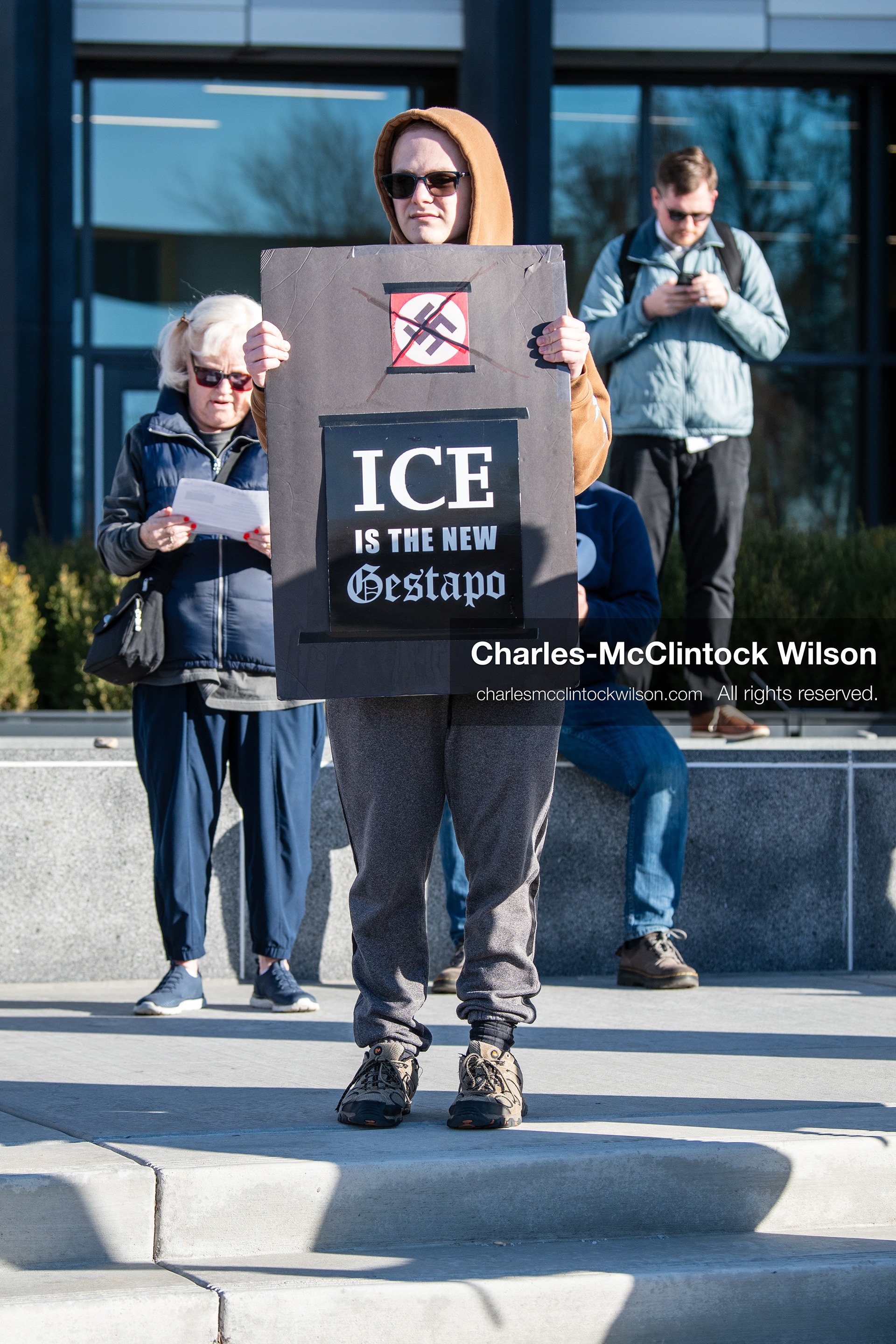  January 20, 2026, Provo, Utah, USA: A demonstrator stands outside Provo City Hall during the Free America Walkout protest in Provo Utah on January 20 2026. The nationwide event called for immigration reform and changes to detention practices.