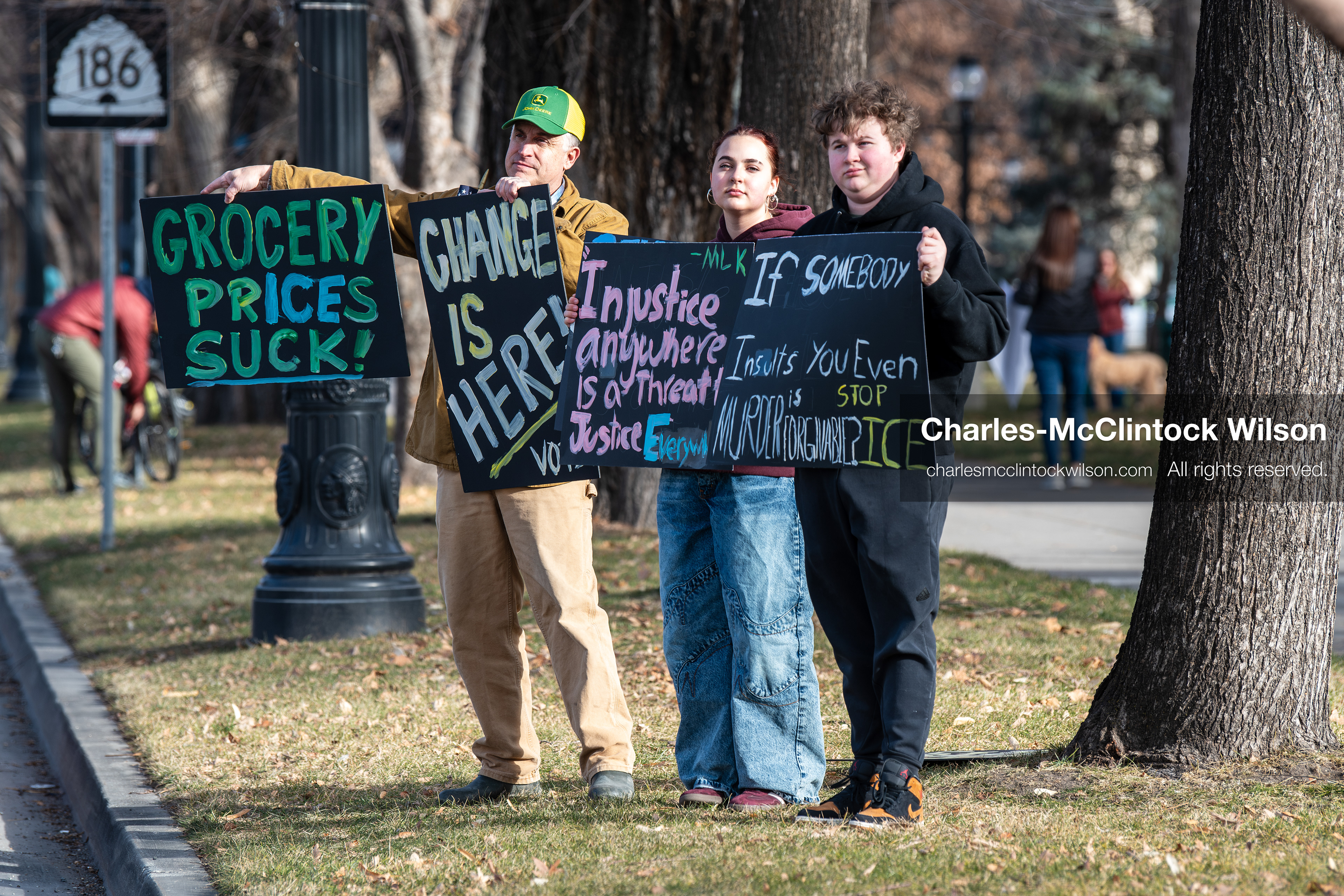 January 30, 2026, Salt Lake City, Utah, USA: Demonstrators hold signs on a sidewalk at Washington Square Park during an anti‑ICE protest in Salt Lake City, part of a nationwide response to immigration enforcement policies. (Credit Image: © Charles‑McClintock Wilson/ZUMA Press Wire)