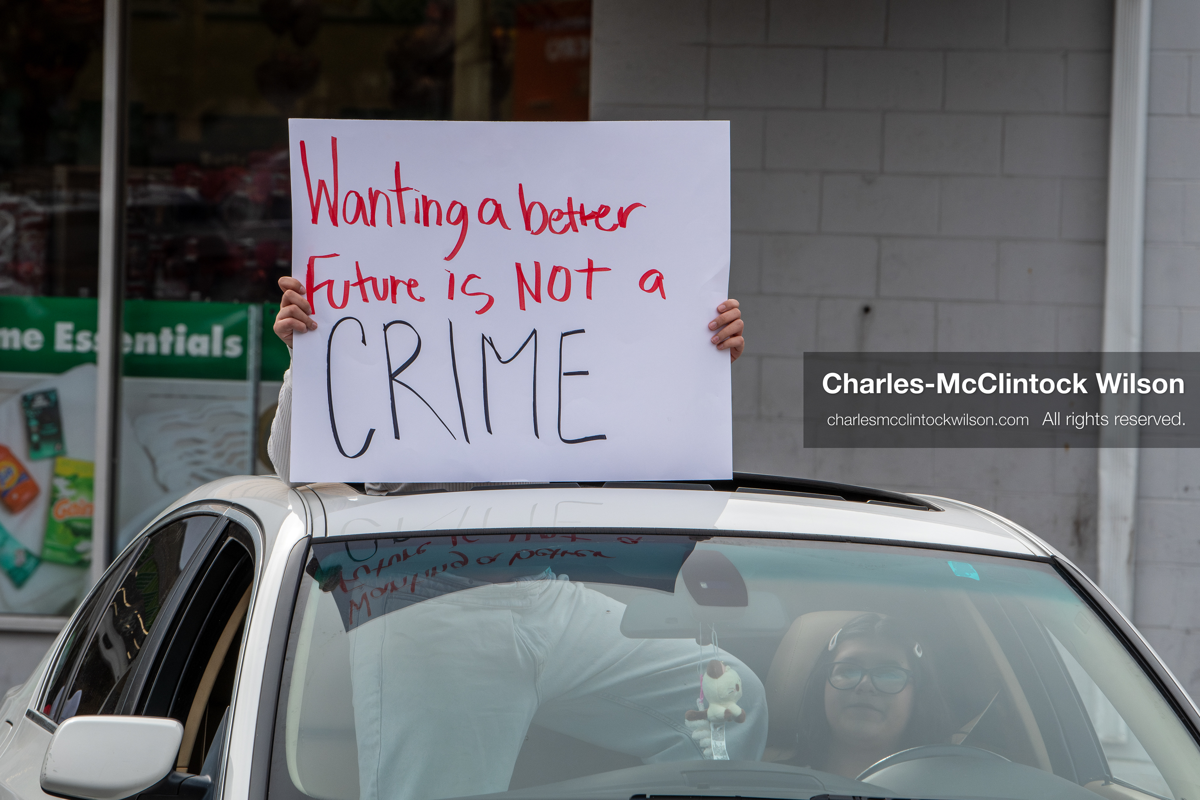 February 11, 2026, Orem, Utah, USA: A student leans out of a car window while participating in a student‑led protest involving participants from multiple Orem schools. (Credit Image: © Charles‑McClintock Wilson/ZUMA Press Wire)