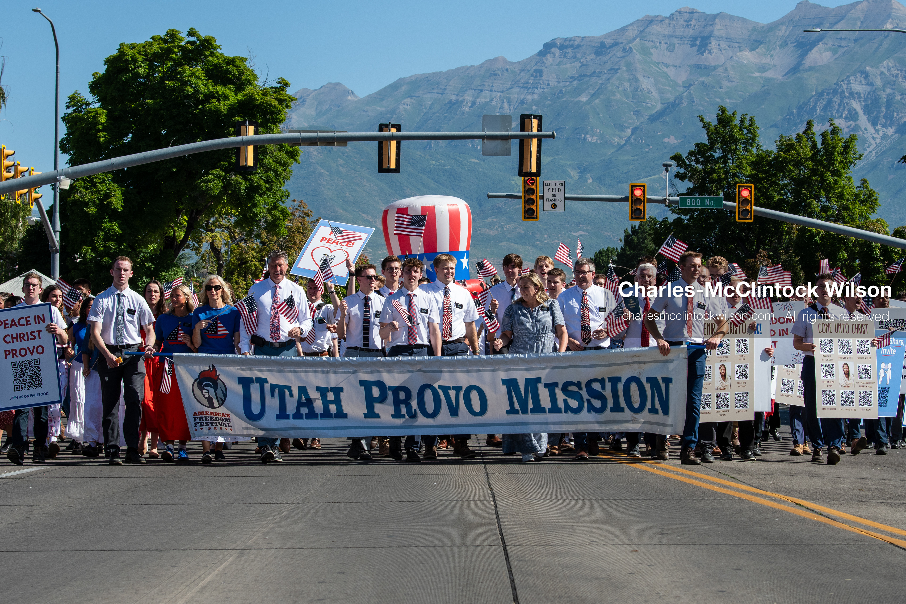 July 4, 2026, Provo, Utah, USA: Missionaries from The Church of Jesus Christ of Latter-day Saints wear black name badges and wave American flags while marching down the street during America's Freedom Festival Grand Parade in Provo, Utah, Saturday, July 4, 2026. The annual Independence Day event features expanded programming to honor the 250th anniversary of United States independence. (Credit Image: © Charles-McClintock Wilson/ZUMA Press Wire)