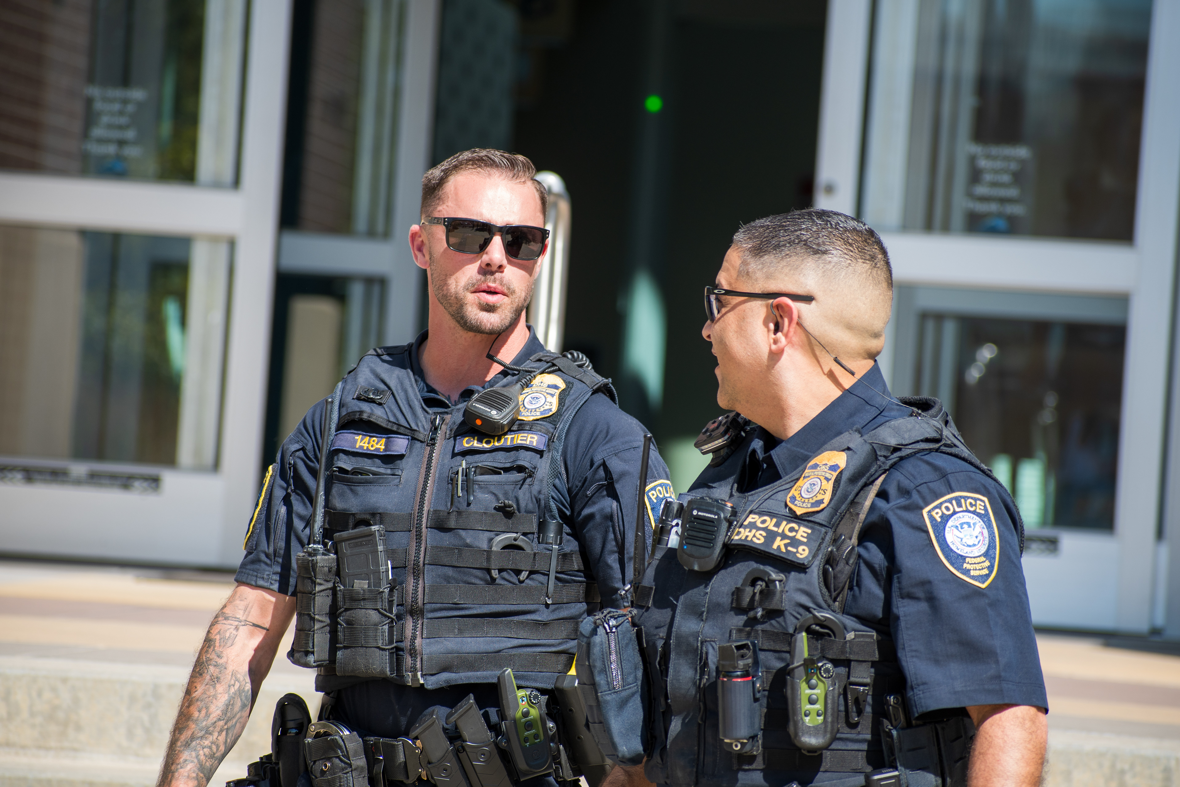 September 15, 2025 – Provo, Utah, United States: Two Homeland Security police officers speak outside the Utah Valley Convention Center during a Department of Homeland Security career expo, part of a national recruitment initiative offering federal law enforcement and security positions. Photograph by Charles‑McClintock Wilson / ZUMA Press Wire