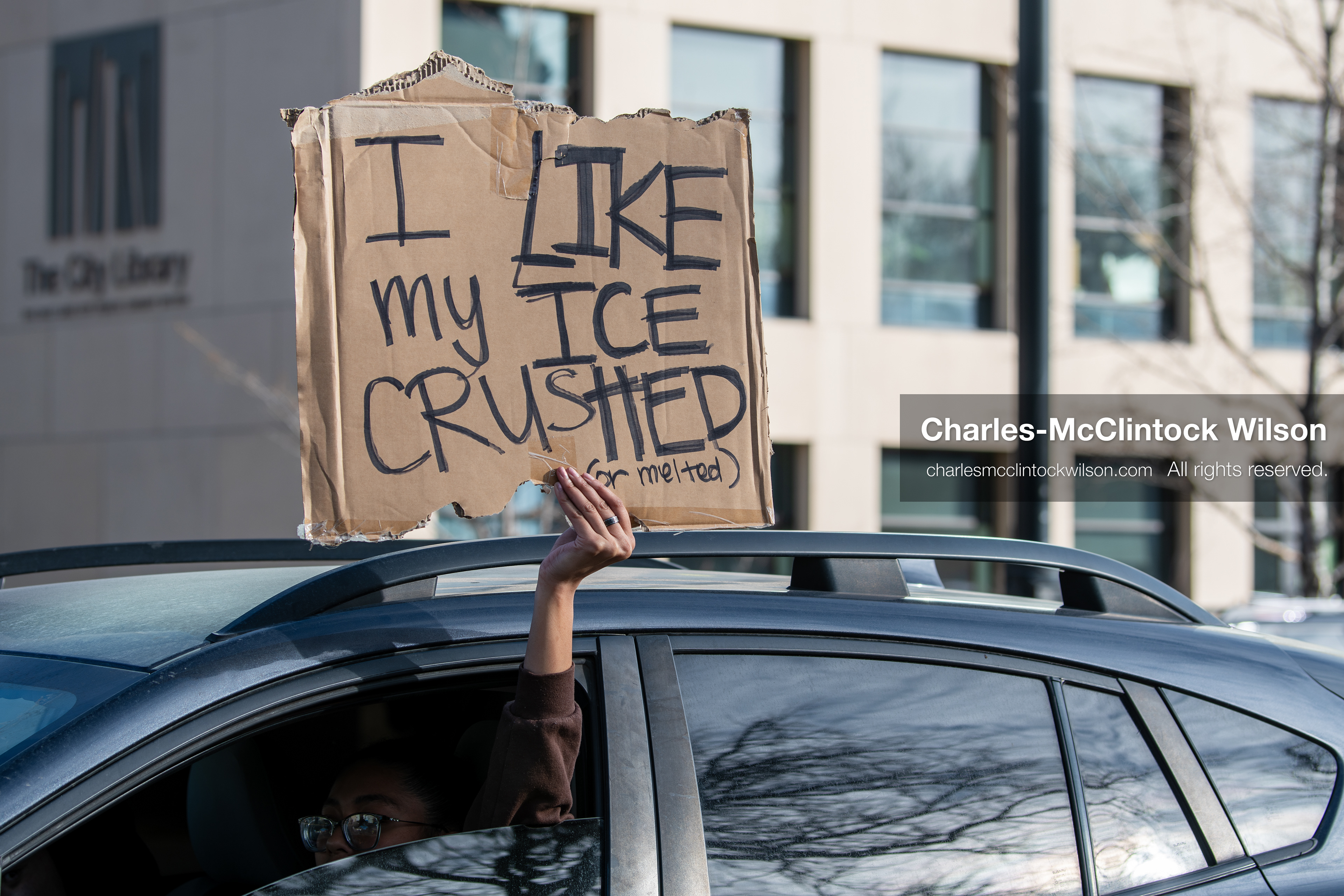 January 30, 2026, Salt Lake City, Utah, USA: A demonstrator displays a protest sign from a vehicle during an anti‑ICE protest in Salt Lake City, part of a nationwide response to immigration enforcement policies. (Credit Image: © Charles‑McClintock Wilson/ZUMA Press Wire)