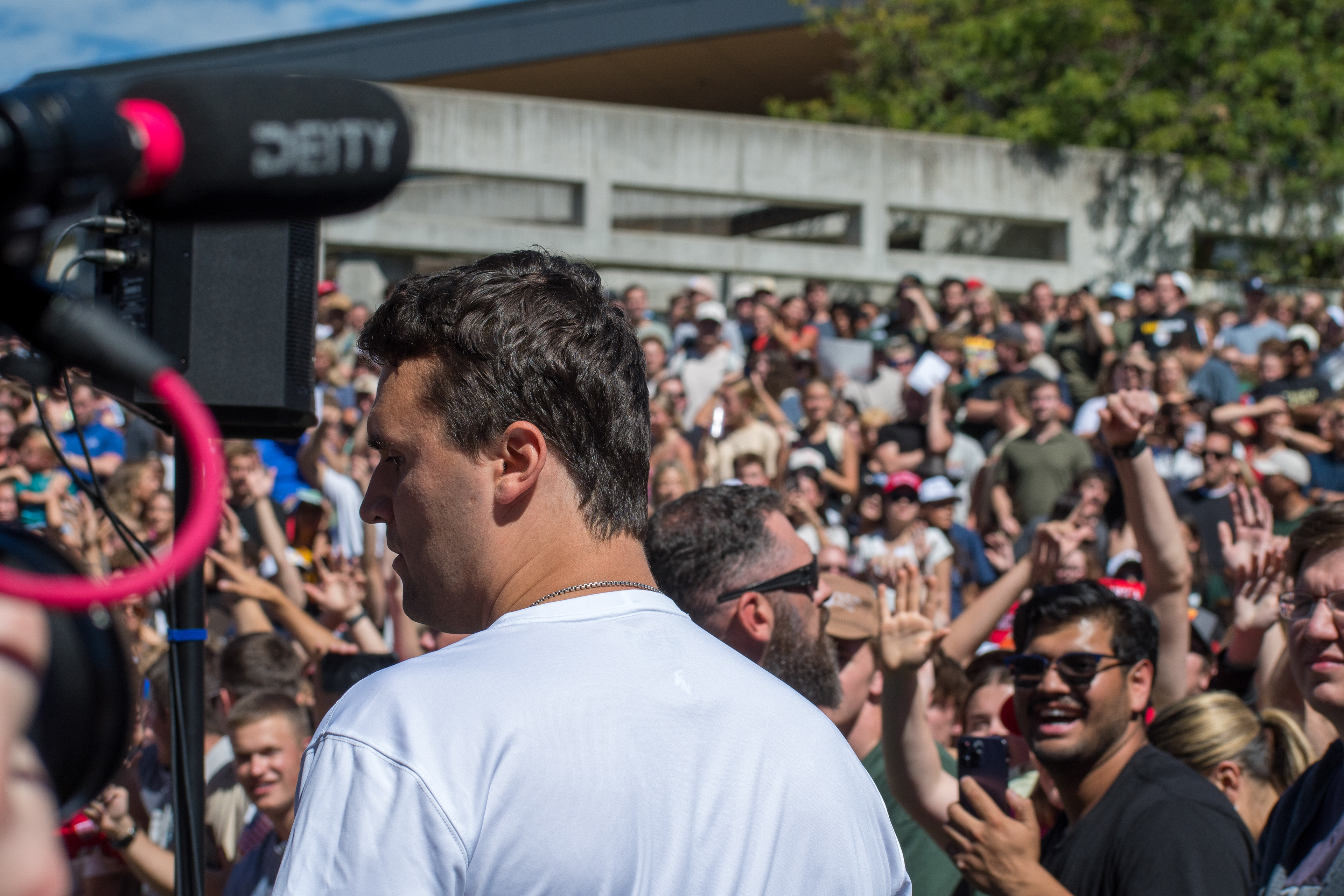 OREM, UTAH – SEPTEMBER 10, 2025: Charlie Kirk stands among supporters during a public event at Utah Valley University. Captured in the foreground as attendees gather around him, Kirk appears engaged and expressive in one of his final public moments. The image reflects the scale and intensity of the crowd’s response, underscoring the civic energy that defined the gathering. © Charles-McClintock Wilson / ZUMA Press 
