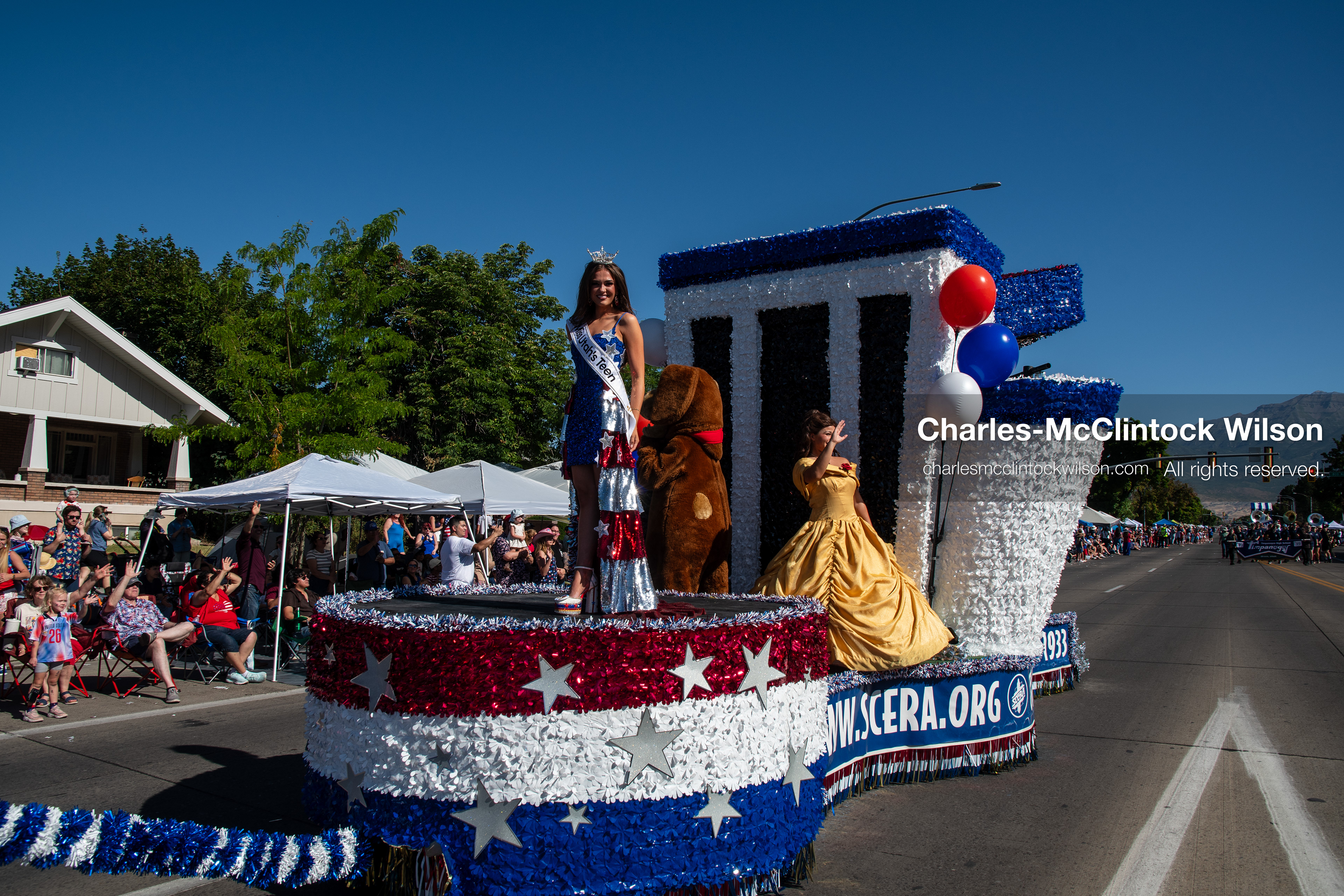 July 4, 2026, Provo, Utah, USA: A pageant titleholder wearing a tiara and sash stands alongside performers on a patriotic SCERA Center for the Arts parade float during America's Freedom Festival Grand Parade in Provo, Utah, Saturday, July 4, 2026. The annual Independence Day event features expanded programming to honor the 250th anniversary of United States independence. (Credit Image: © Charles-McClintock Wilson/ZUMA Press Wire)