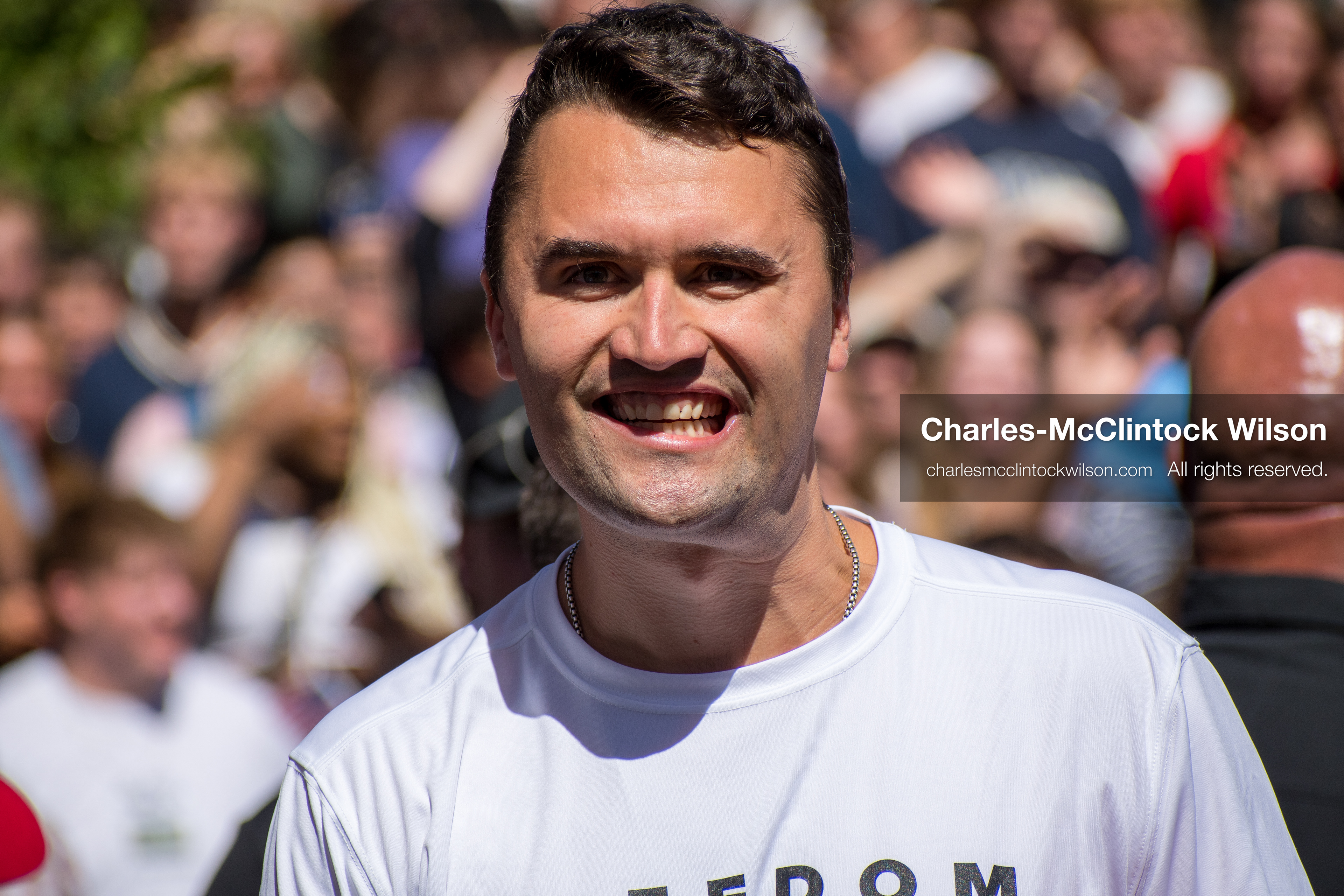 OREM, UTAH – SEPTEMBER 10, 2025: Charlie Kirk speaks with attendees during a public event at Utah Valley University. Positioned near a promotional booth and surrounded by supporters, Kirk appears engaged and expressive in one of his final public moments. The image reflects the atmosphere of direct outreach and energized dialogue that defined the gathering. © Charles-McClintock Wilson / ZUMA Press