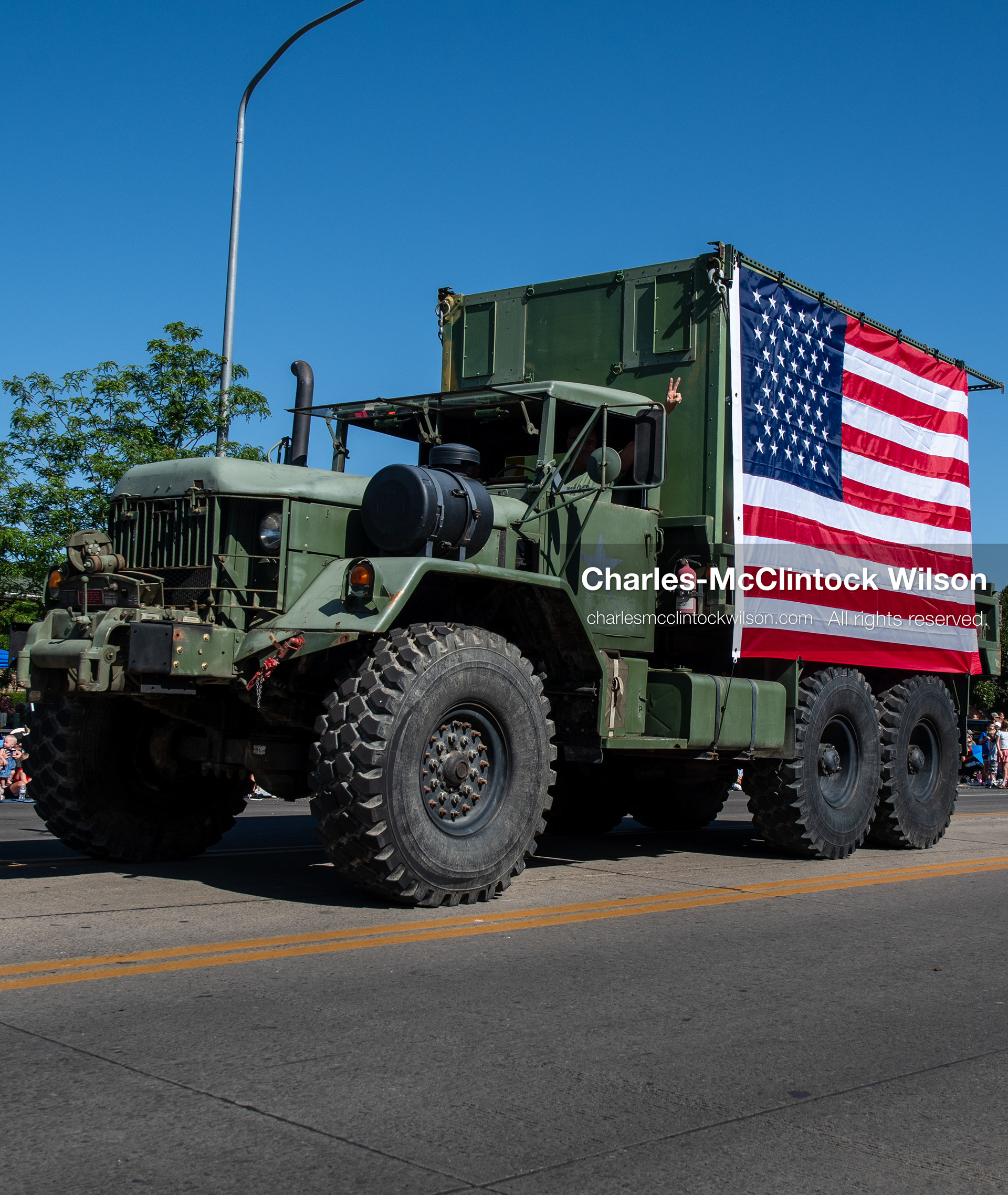 July 4, 2026, Provo, Utah, USA: A vintage military cargo truck draped with a large American flag drives along the route during America's Freedom Festival Grand Parade in Provo, Utah, Saturday, July 4, 2026. The annual Independence Day event features expanded programming to honor the 250th anniversary of United States independence. (Credit Image: © Charles-McClintock Wilson/ZUMA Press Wire)