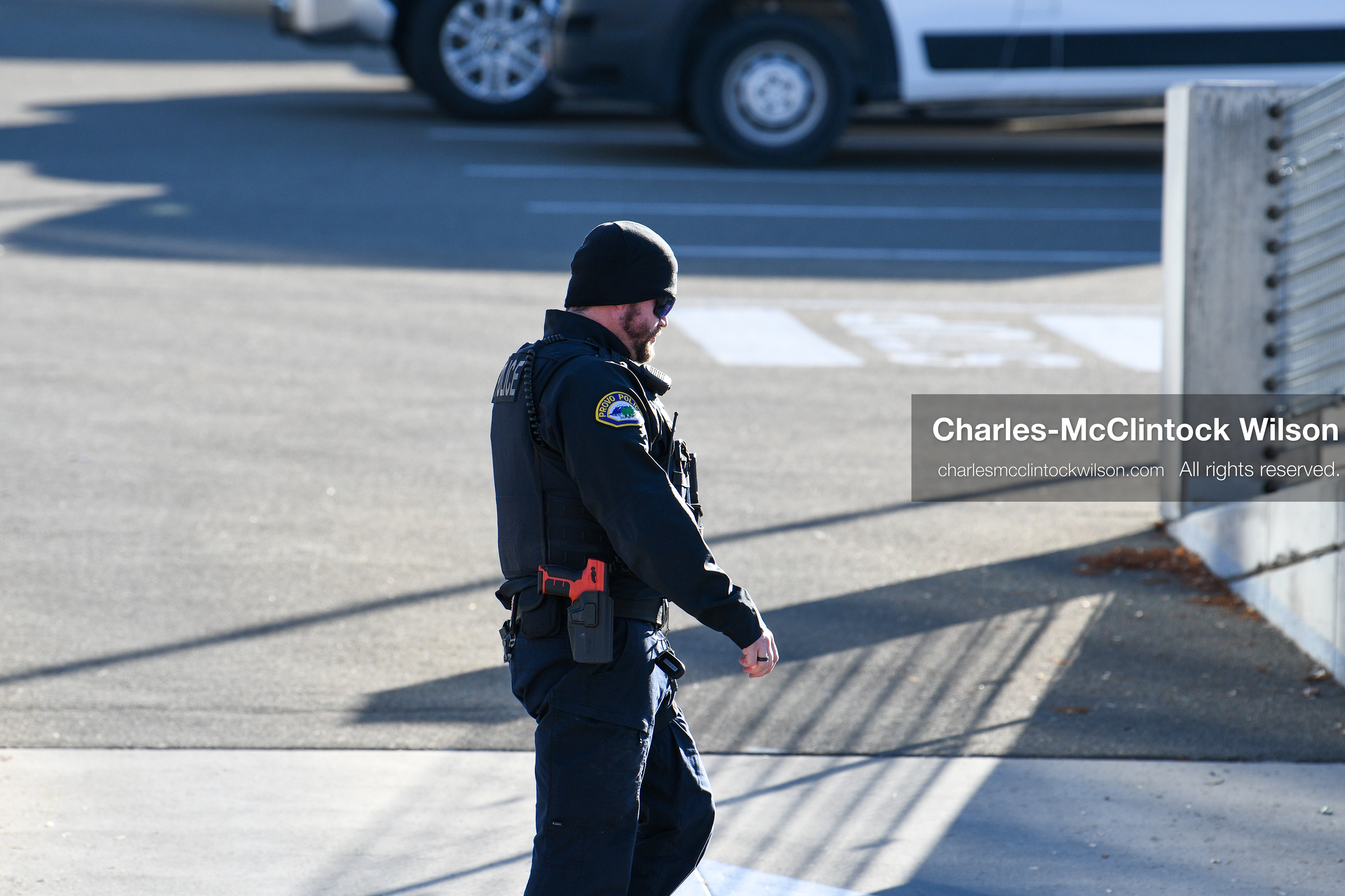 PROVO, UTAH, USA – DECEMBER 11, 2025: A Provo Police officer patrols on foot near the Fourth District Court in Provo during the first in‑person court appearance of Tyler Robinson in the Charlie Kirk murder case. (Credit Image: © Charles‑McClintock Wilson/ZUMA Press Wire)