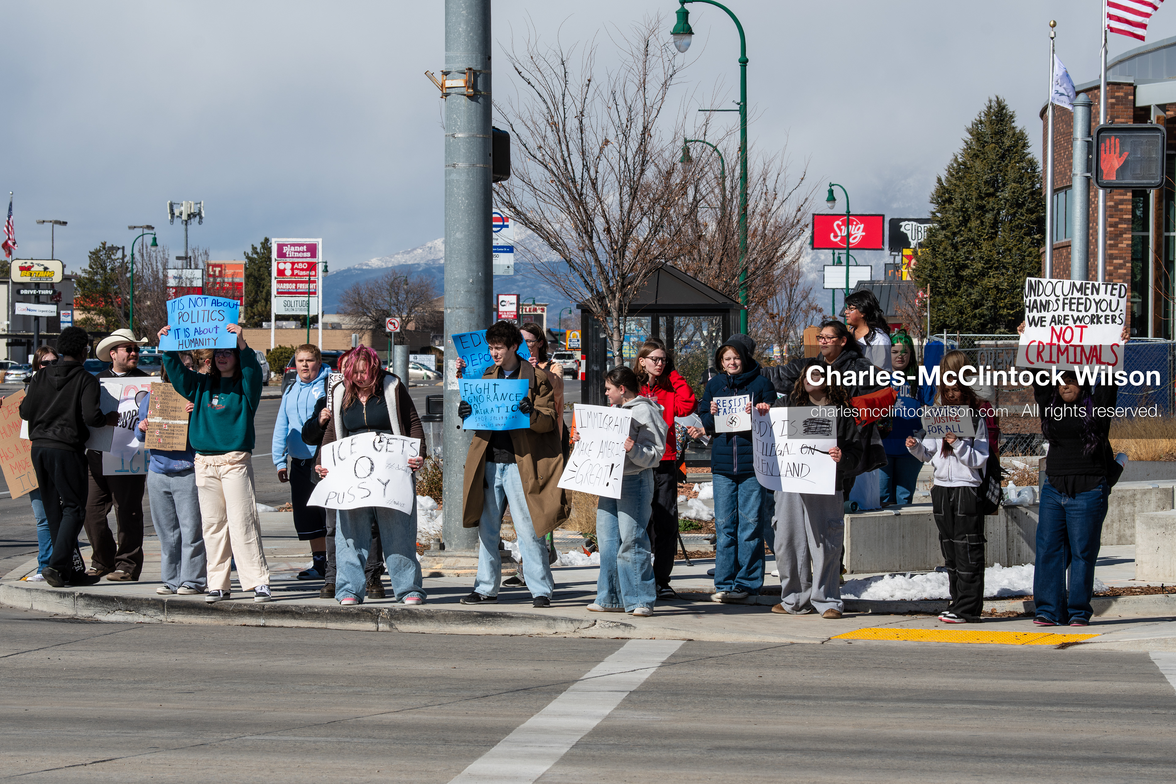 February 20, 2026, Orem, Utah, USA: High school students gather along State Street in front of Orem City Hall during a student led protest against ICE and federal immigration enforcement. Demonstrators hold signs as they stand near the roadway while traffic continues through the area. (Credit Image: © Charles McClintock Wilson/ZUMA Press Wire)