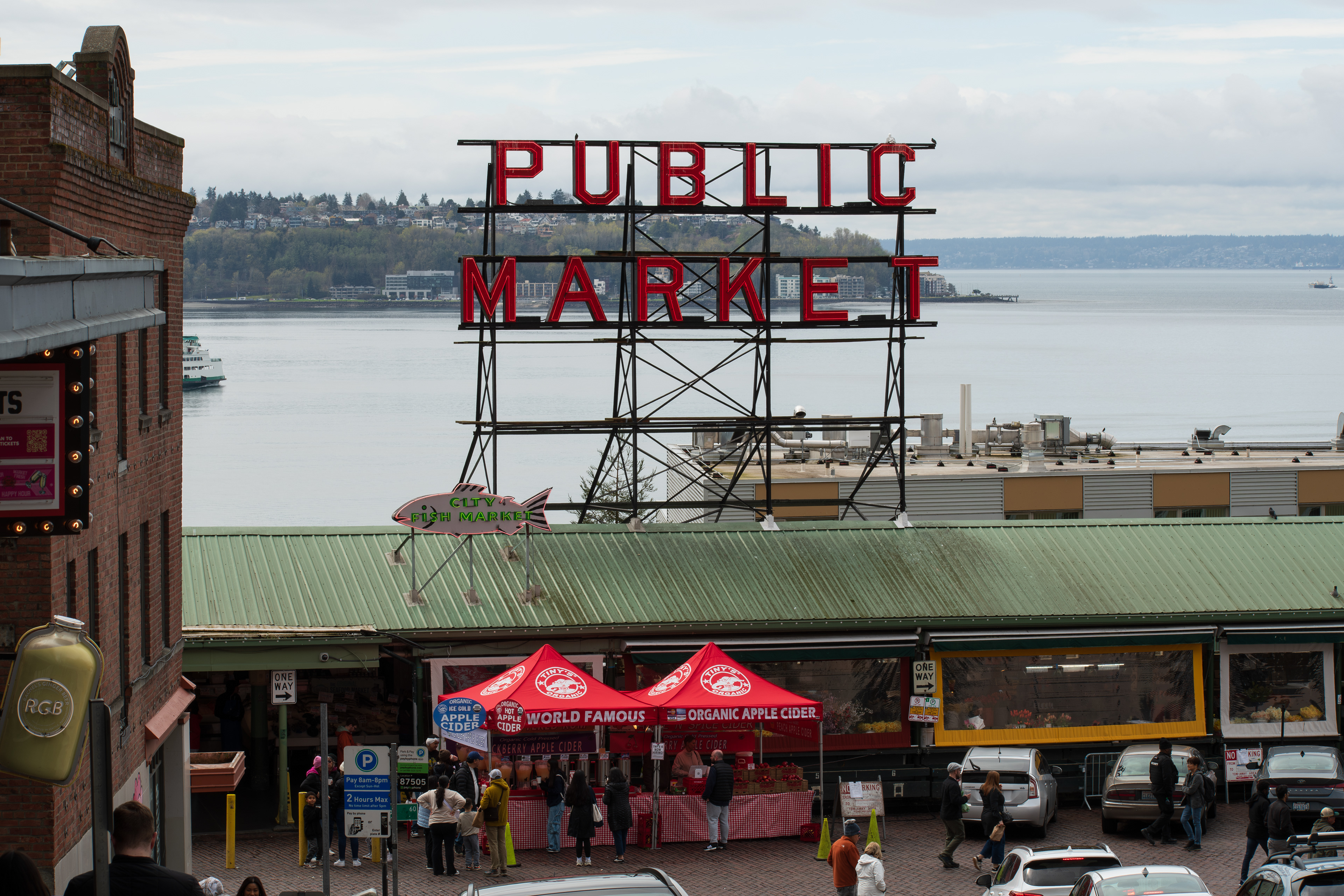 SEATTLE, WA, USA - APR 7, 2025: Public Market Sign at the landmark Pike Place Market in downtown Seattle, Washington, United States on a cloudy day. The market opened on August 17, 1907. 