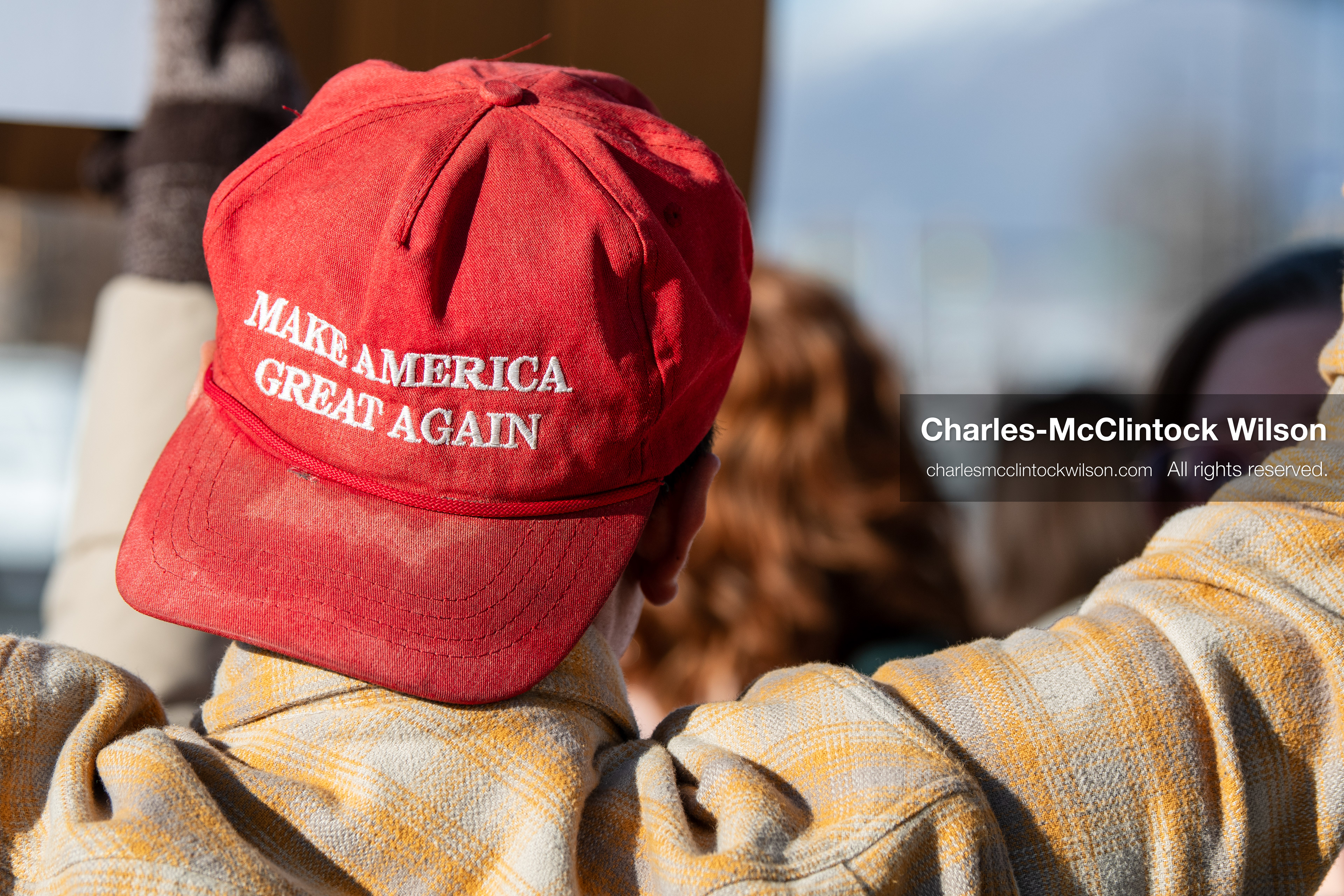 January 20, 2026, Provo, Utah, USA: A person wearing a Make America Great Again hat raises an arm during the Free America Walkout outside Provo City Hall in Provo Utah on January 20 2026. The nationwide protest drew demonstrators with varied political views. (Credit Image: © Charles-McClintock Wilson/ZUMA Press Wire)