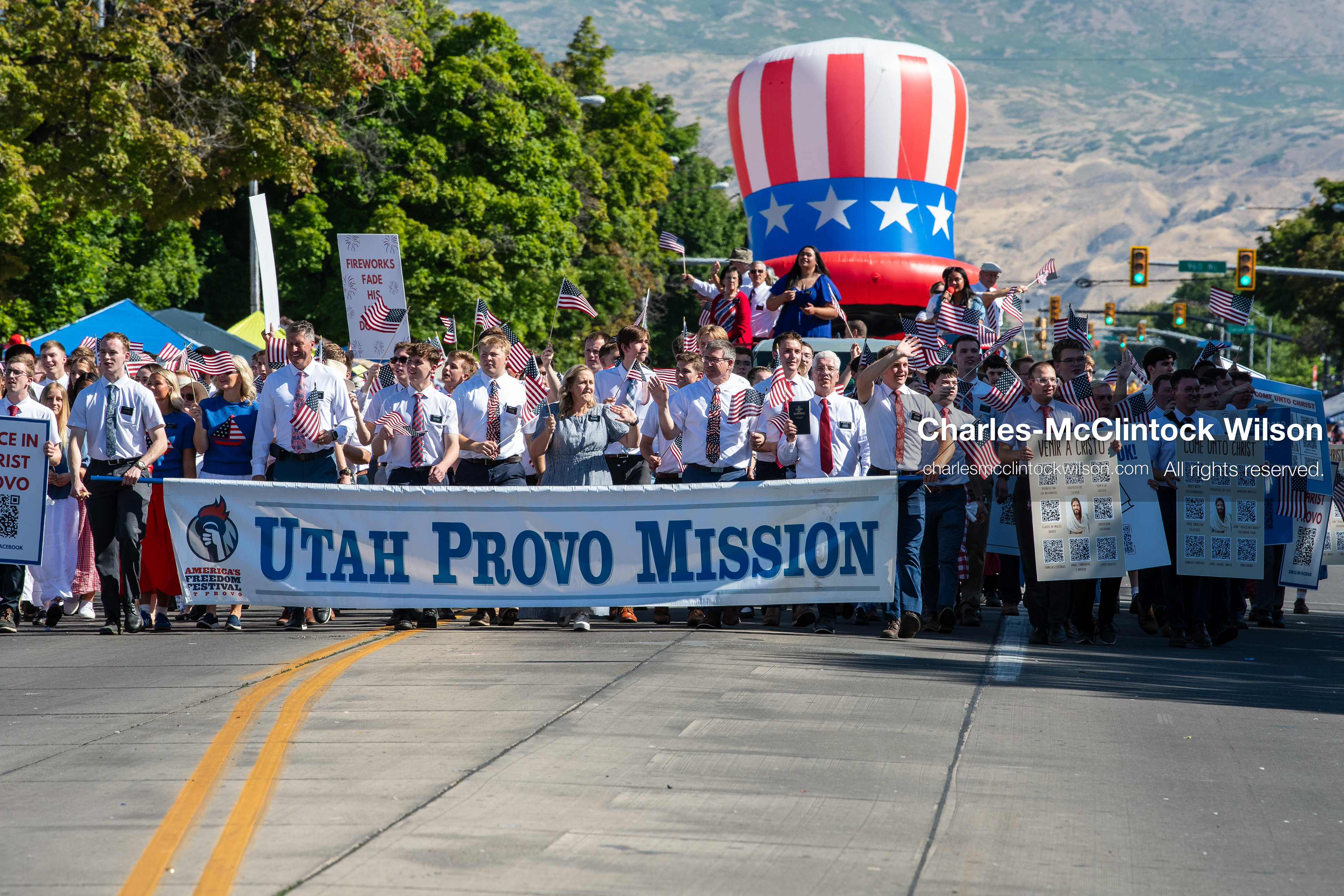 July 4, 2026, Provo, Utah, USA: Missionaries from The Church of Jesus Christ of Latter-day Saints wear black name badges and wave American flags while marching down the street during America's Freedom Festival Grand Parade in Provo, Utah, Saturday, July 4, 2026. The annual Independence Day event features expanded programming to honor the 250th anniversary of United States independence. (Credit Image: © Charles-McClintock Wilson/ZUMA Press Wire)