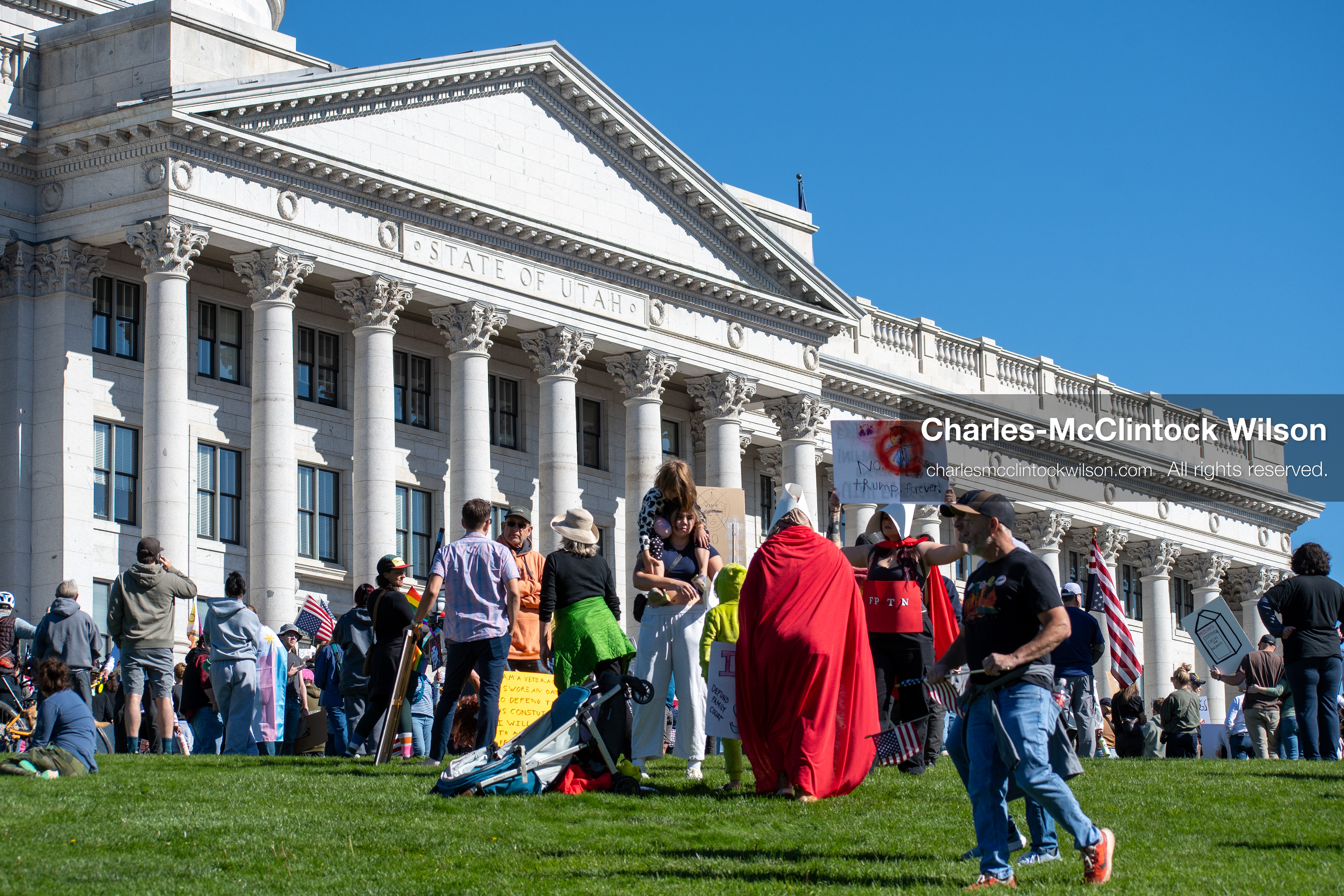 October 18, 2025, Salt Lake City, Utah, USA: Demonstrators gather on the lawn of the Utah State Capitol during a "No Kings" protest. The protest was part of a nationwide mobilization.