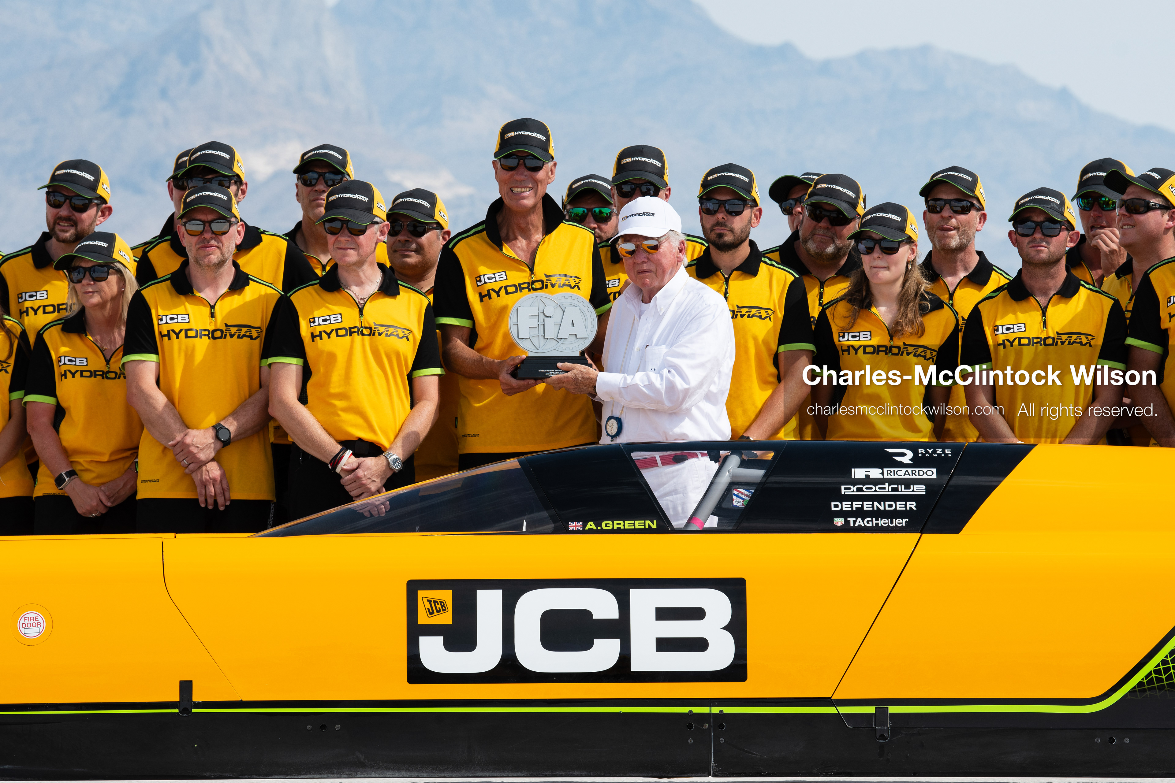 August 11, 2026, Wendover, Utah, USA: British pilot Andy Green receives an official FIA record trophy from JCB Chairman Anthony Bamford behind the cockpit of the ''JCB Hydromax'' on the Bonneville Salt Flats on Tuesday. The team celebrated setting a new hydrogen land speed record of 406.320 mph. (Credit Image: © Charles McClintock Wilson/ZUMA Press Wire)