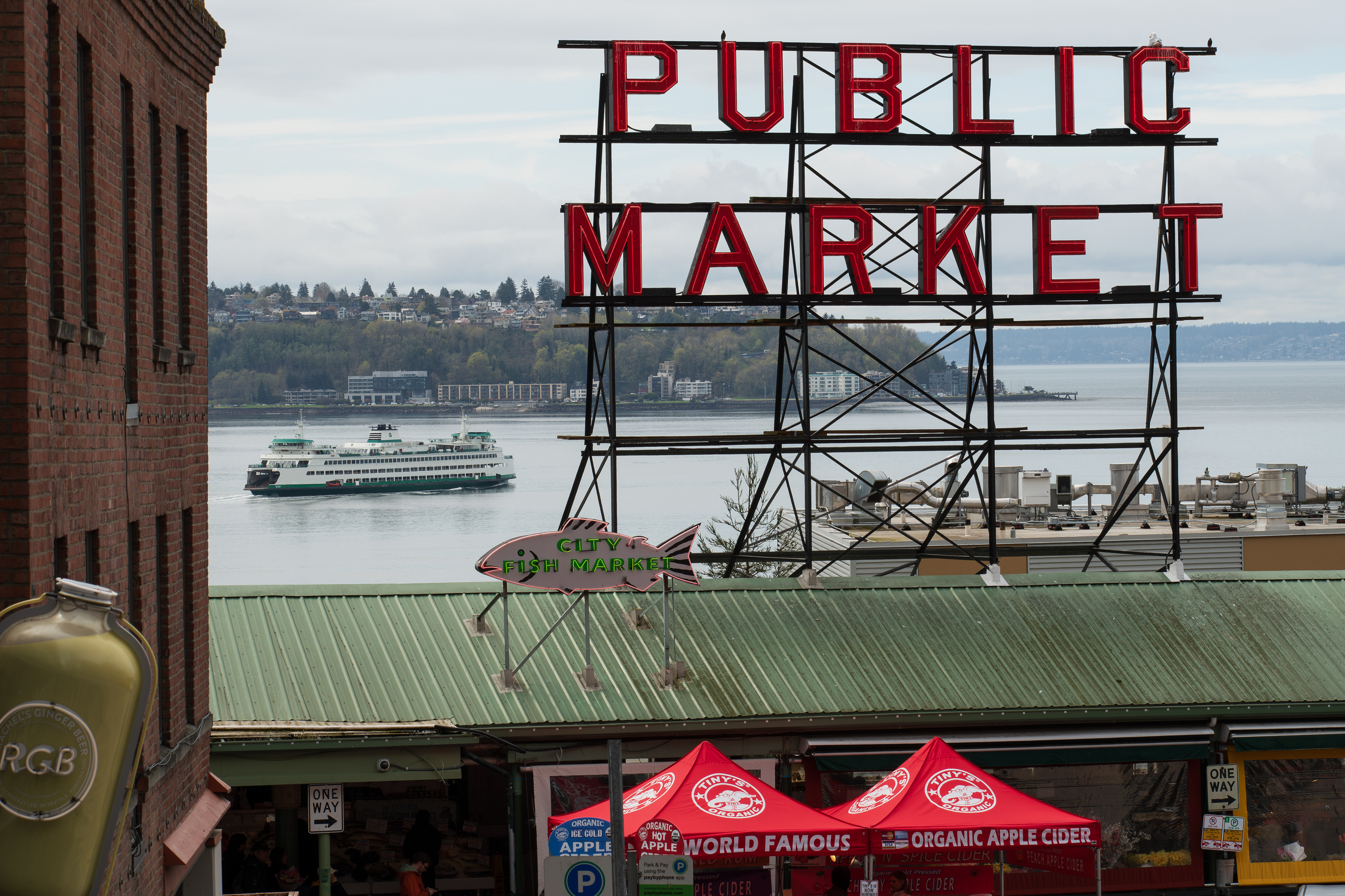 SEATTLE, WA, USA - APR 7, 2025: Public Market Sign at the landmark Pike Place Market in downtown Seattle, Washington, United States on a cloudy day. The market opened on August 17, 1907. 