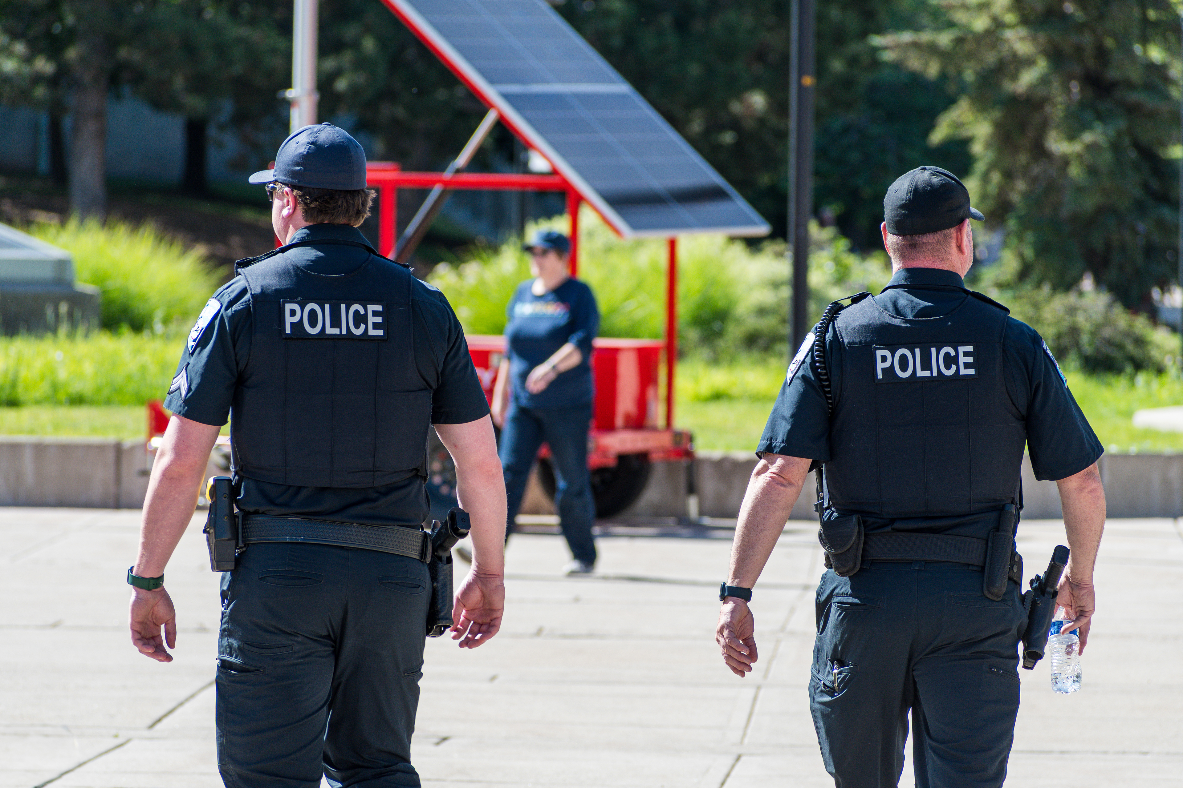 SALT LAKE CITY, UTAH – JUNE 14, 2025: Two police officers patrol the University of Utah campus during the “No Kings” protest calling for democracy and opposing authoritarian rule.