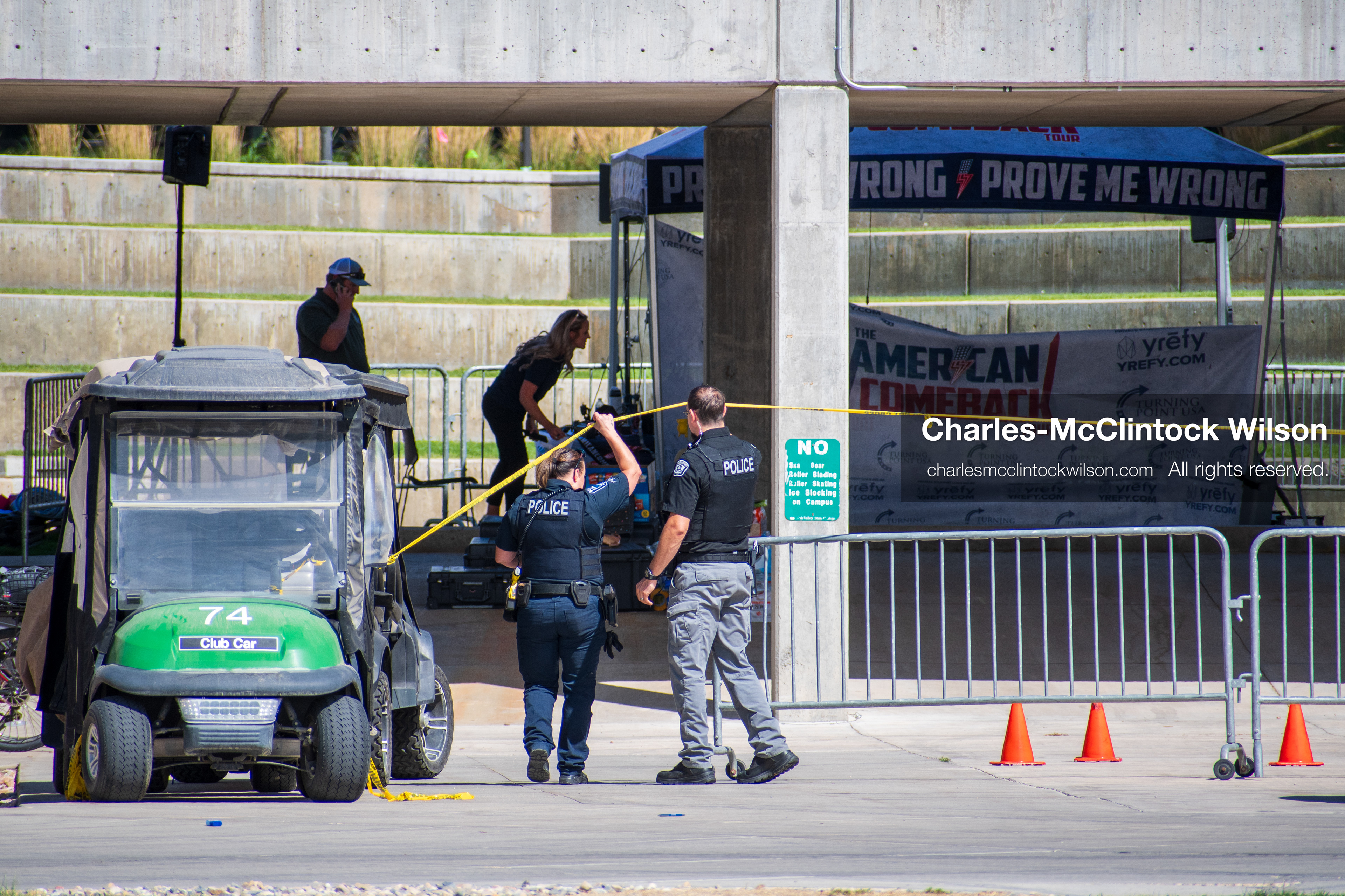 September 12, 2025, Orem, Utah, USA: Investigators and police officers secure the canopy-covered courtyard at Utah Valley University in Orem, Utah, where conservative activist CHARLIE KIRK was fatally shot during a public speaking event on September 10, 2025. KIRK, CEO of Turning Point USA, was seated beneath the canopy when a single bullet struck him in the neck.   (Credit Image: © Charles‑McClintock Wilson/ZUMA Press Wire)
