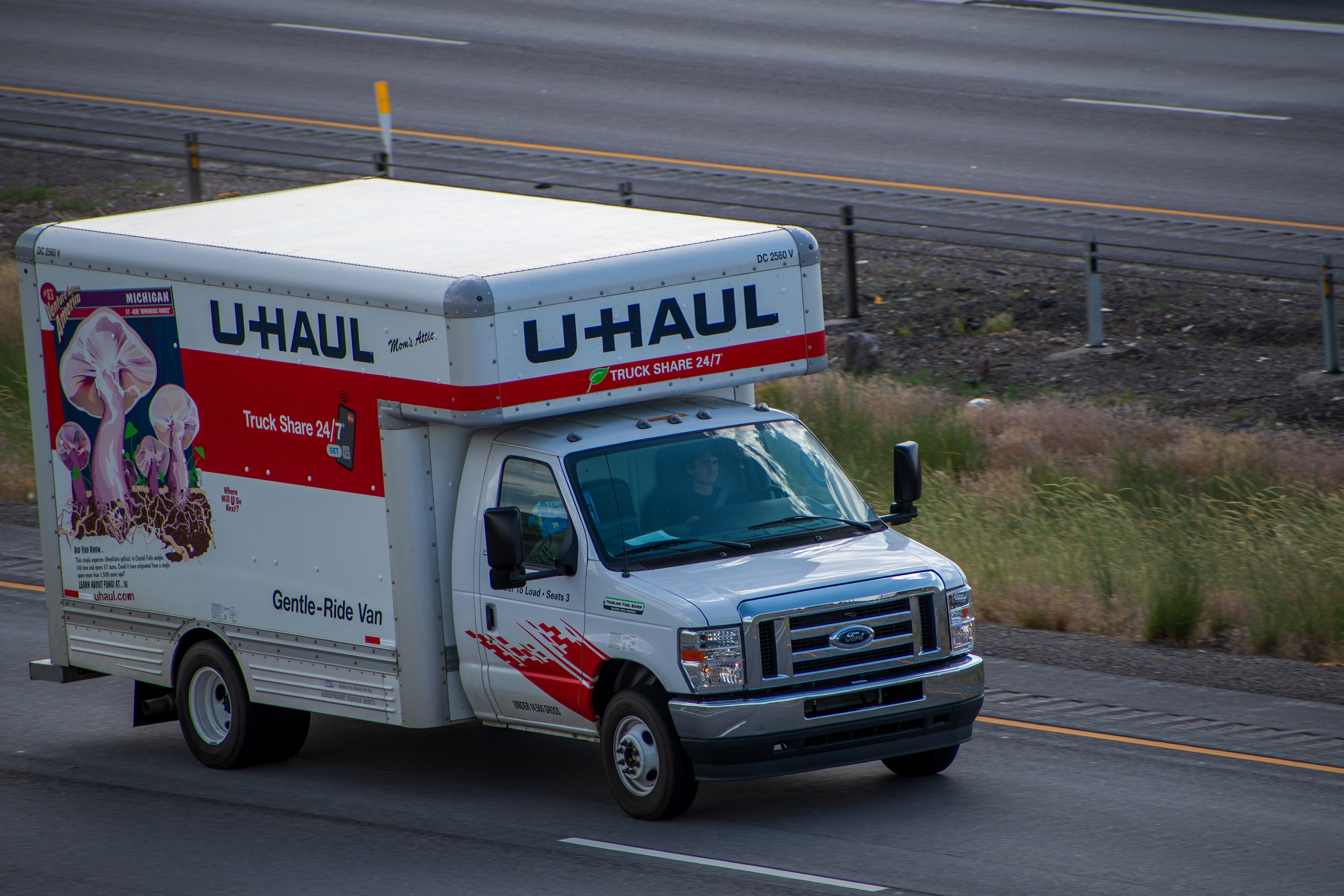 SANTAQUIN, UT – JUNE 8, 2025: A U-Haul moving truck travels northbound on Interstate 15 near Santaquin, Utah. U-Haul is a popular American moving equipment and storage rental company.