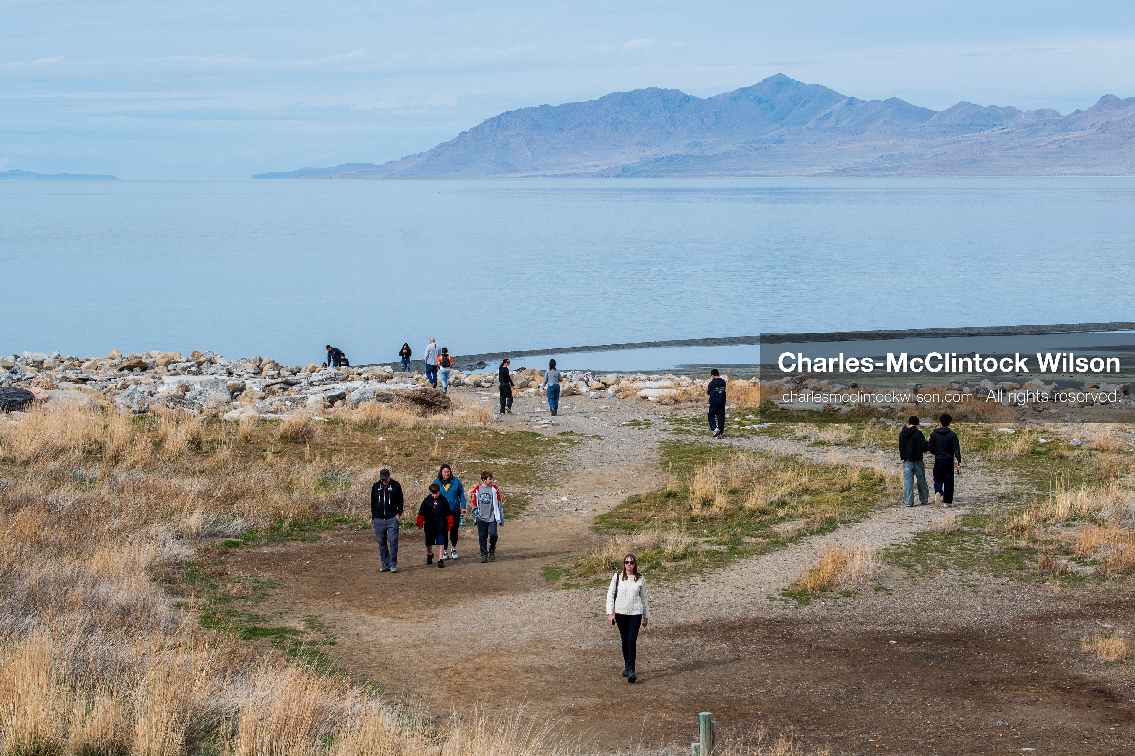 March 1, 2026, Great Salt Lake, Utah, USA: People walk along the shoreline of the Great Salt Lake as water levels remain historically low. Reports from state officials and the Great Salt Lake Strike Team state that the lake continues to fall within a serious adverse‑effects range, with elevations among the lowest recorded in more than one hundred years. The lake has drawn increased public attention as lawmakers consider large‑scale water projects and long‑term plans to address declining conditions. (Credit Image: © Charles‑McClintock Wilson/ZUMA Press Wire)