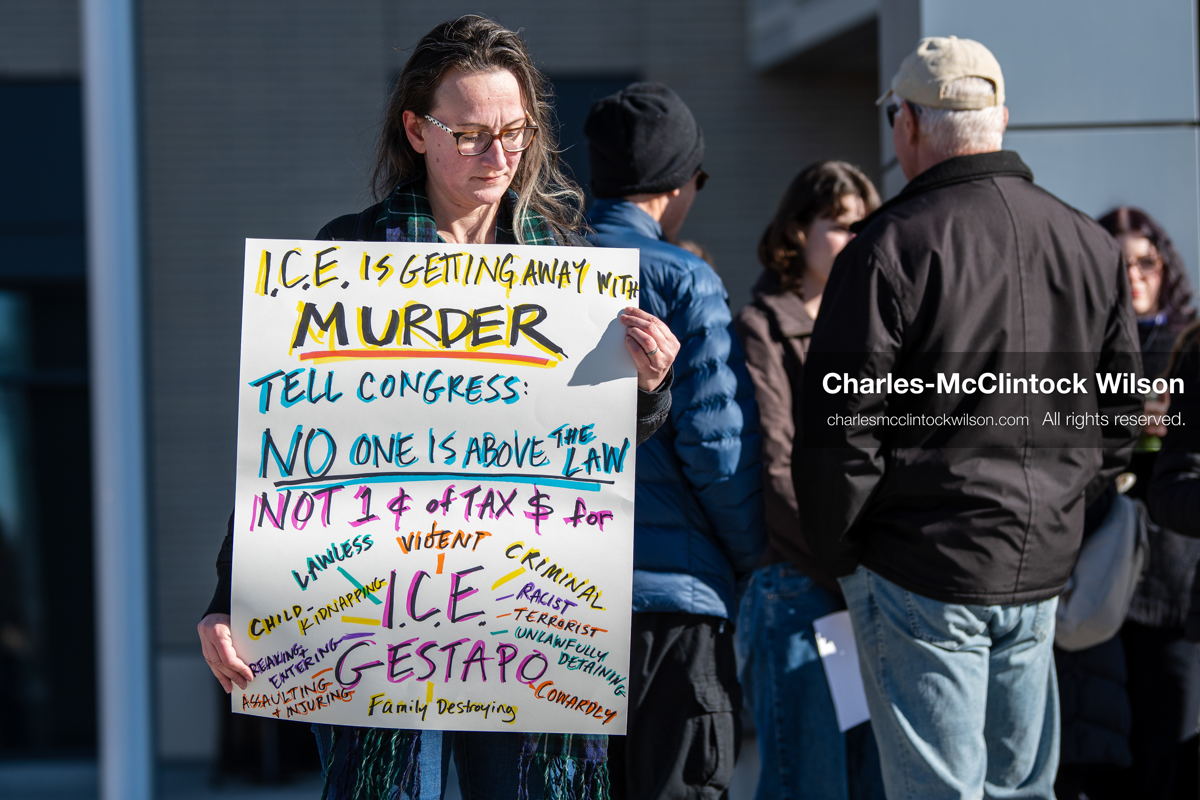  January 20, 2026, Provo, Utah, USA: A demonstrator stands outside Provo City Hall during the Free America Walkout protest in Provo Utah on January 20 2026. The nationwide event called for immigration reform and changes to detention practices.