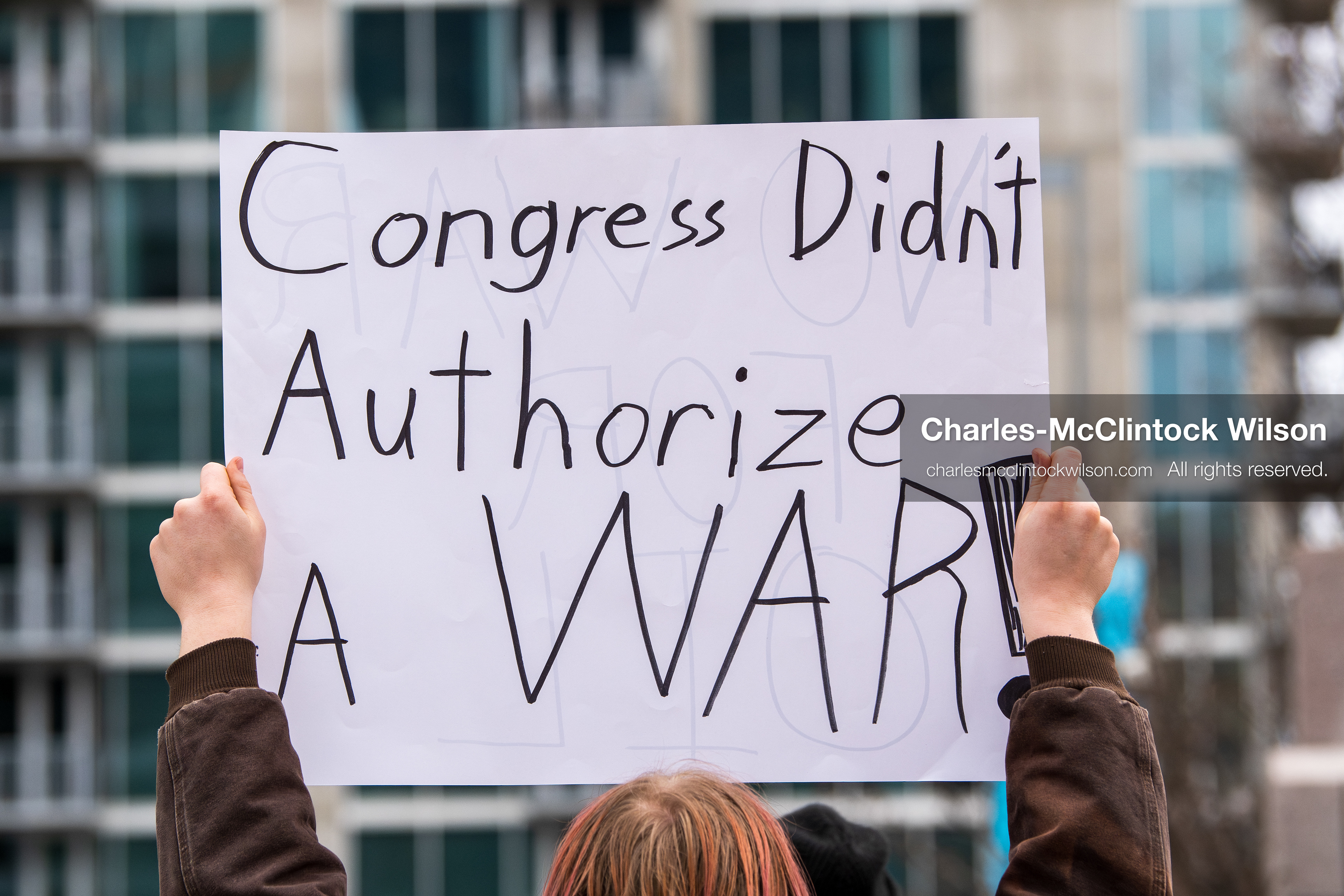 January 3, 2026, Salt Lake City, Utah, USA: A protester holds a sign during a demonstration against US action in Venezuela outside the Wallace Federal Building in Salt Lake City, Utah. The protest was part of a nationwide mobilization responding to recent military developments. (Credit Image: (c) Charles‑McClintock Wilson/ZUMA Press Wire)