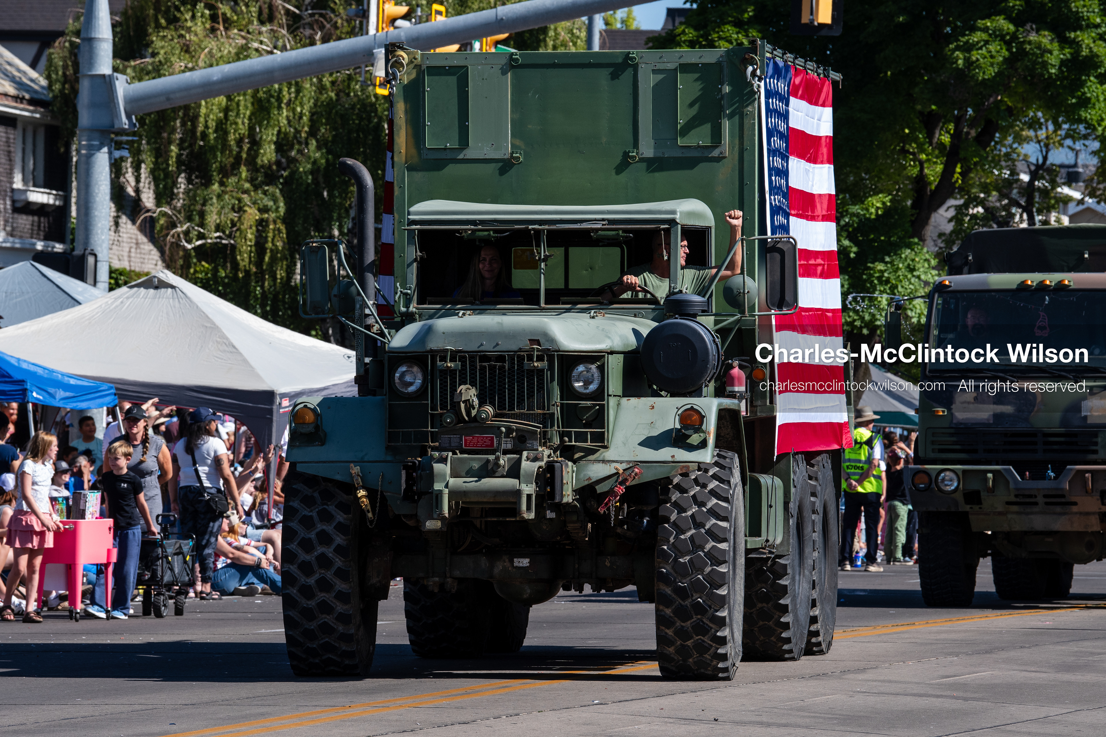 July 4, 2026, Provo, Utah, USA: A vintage military cargo truck draped with a large American flag drives along the route during America's Freedom Festival Grand Parade in Provo, Utah, Saturday, July 4, 2026. The annual Independence Day event features expanded programming to honor the 250th anniversary of United States independence. (Credit Image: © Charles-McClintock Wilson/ZUMA Press Wire)