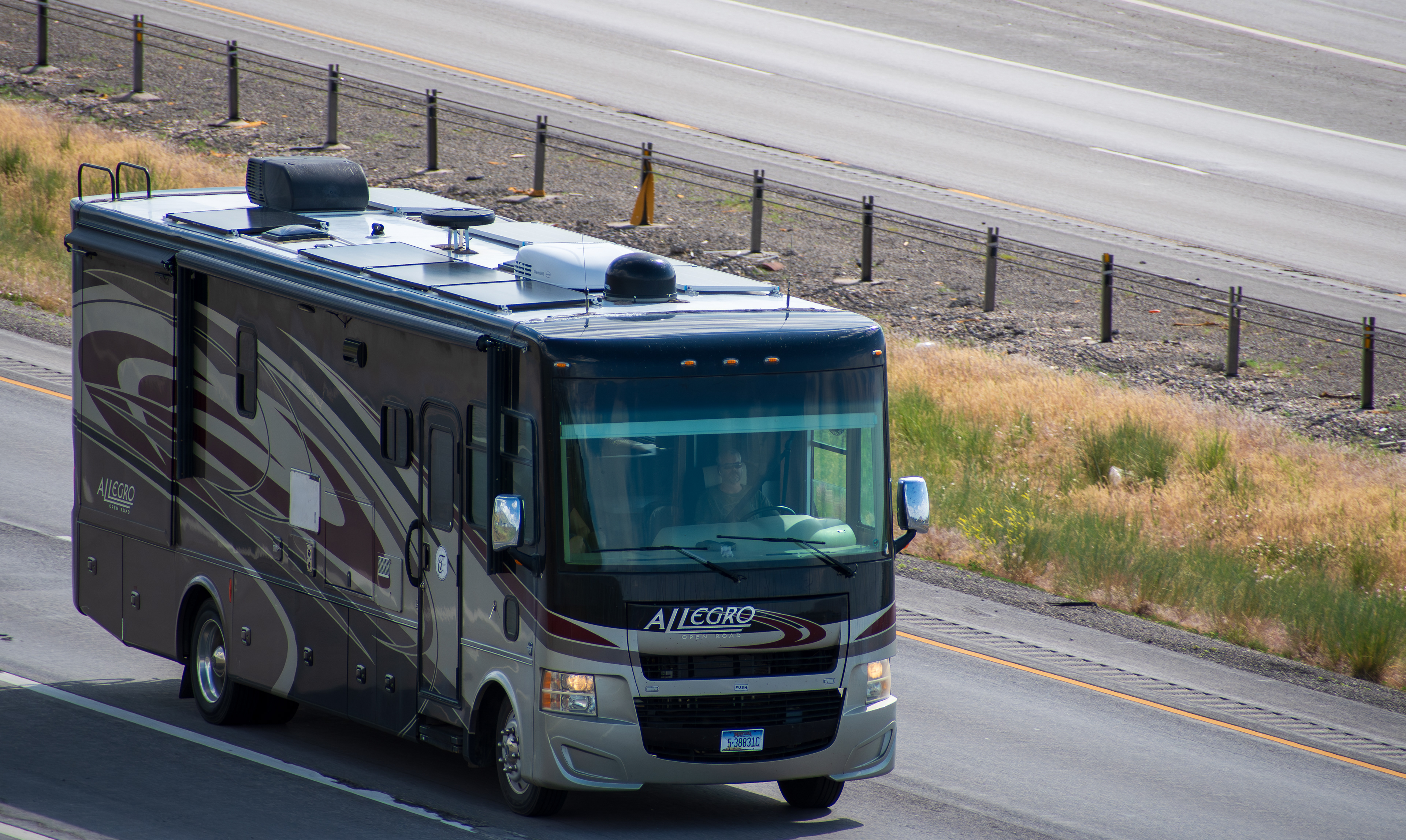 SANTAQUIN, UT – JUNE 8, 2025: A recreational vehicle (RV) travels north on Interstate 15 near Santaquin, Utah. The summer season draws RV travelers through the state, known for its national parks.