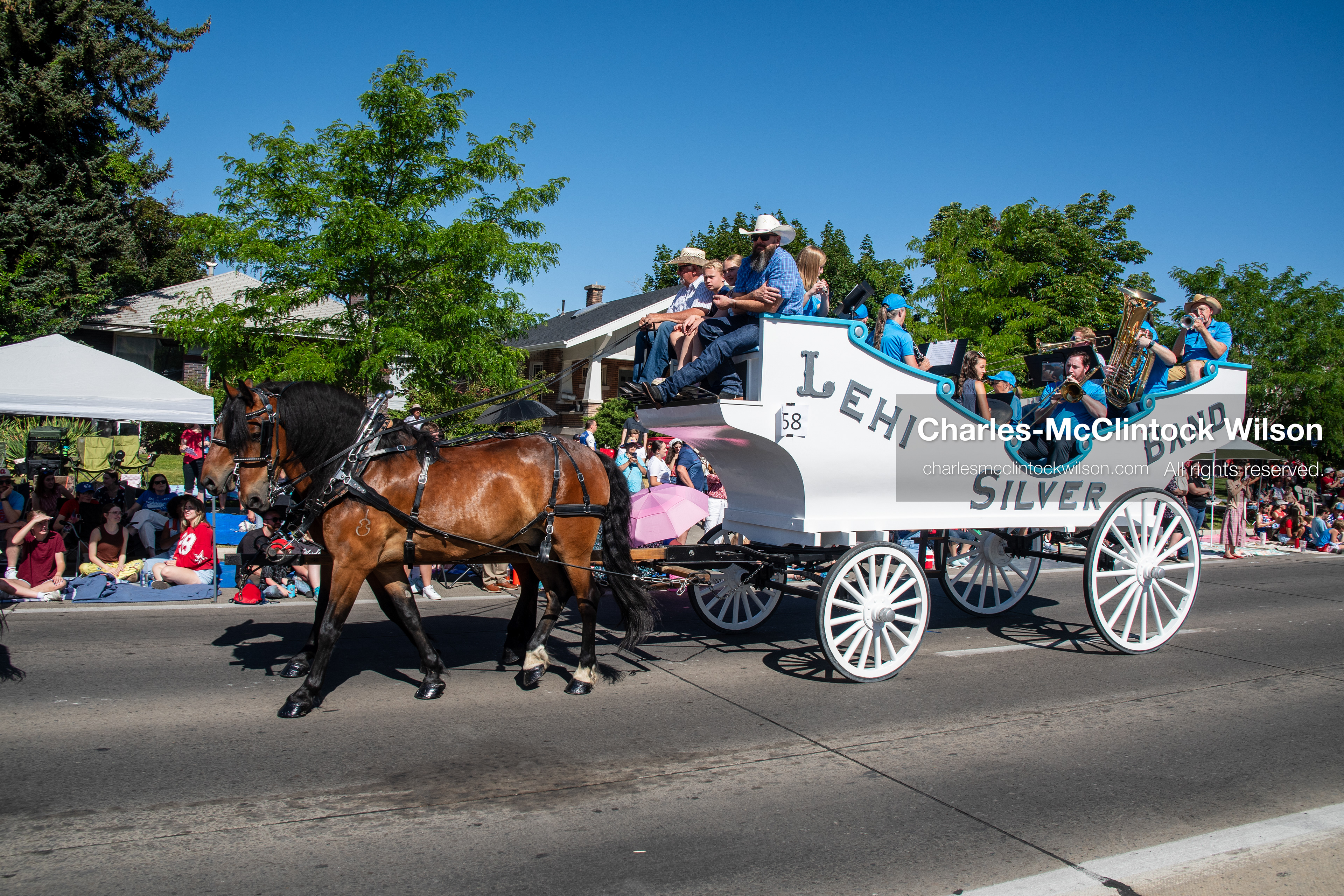 July 4, 2026, Provo, Utah, USA: A horse-drawn wagon carrying members of the Lehi Silver Band rolls down the street during America's Freedom Festival Grand Parade in Provo, Utah, Saturday, July 4, 2026. The annual Independence Day event features expanded programming to honor the 250th anniversary of United States independence. (Credit Image: © Charles-McClintock Wilson/ZUMA Press Wire)