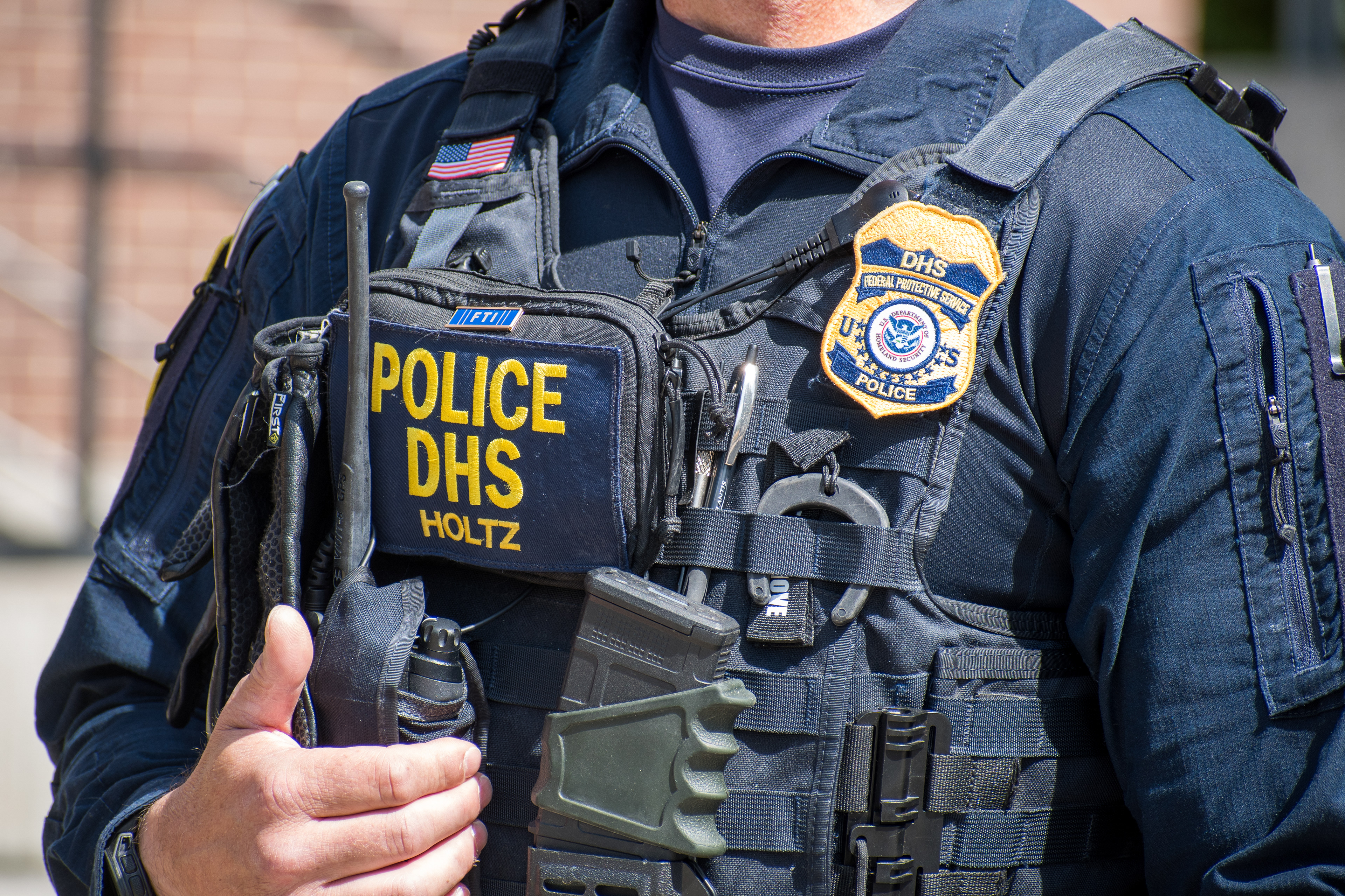 September 15, 2025 – Provo, Utah, United States: A Homeland Security police officer stands outside the Utah Valley Convention Center during a Department of Homeland Security career expo focused on recruiting law enforcement and security personnel. Photograph by Charles‑McClintock Wilson / ZUMA Press Wire