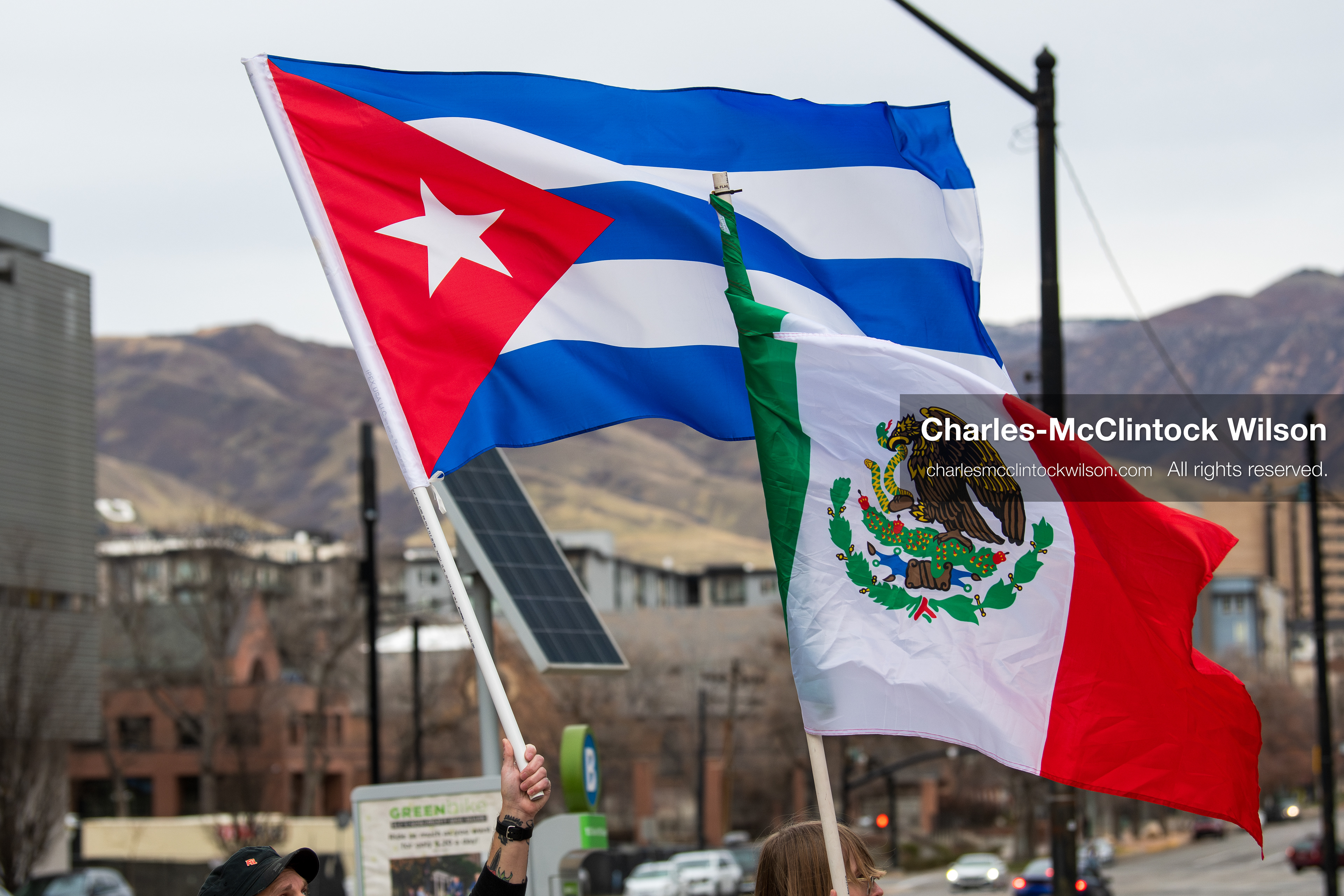 January 3, 2026, Salt Lake City, Utah, USA: Protesters hold signs and flags, including the Venezuelan flag, during a demonstration against US action in Venezuela outside the Wallace Federal Building in Salt Lake City, Utah. The protest was part of a nationwide mobilization responding to recent military developments. (Credit Image: (c) Charles‑McClintock Wilson/ZUMA Press Wire)