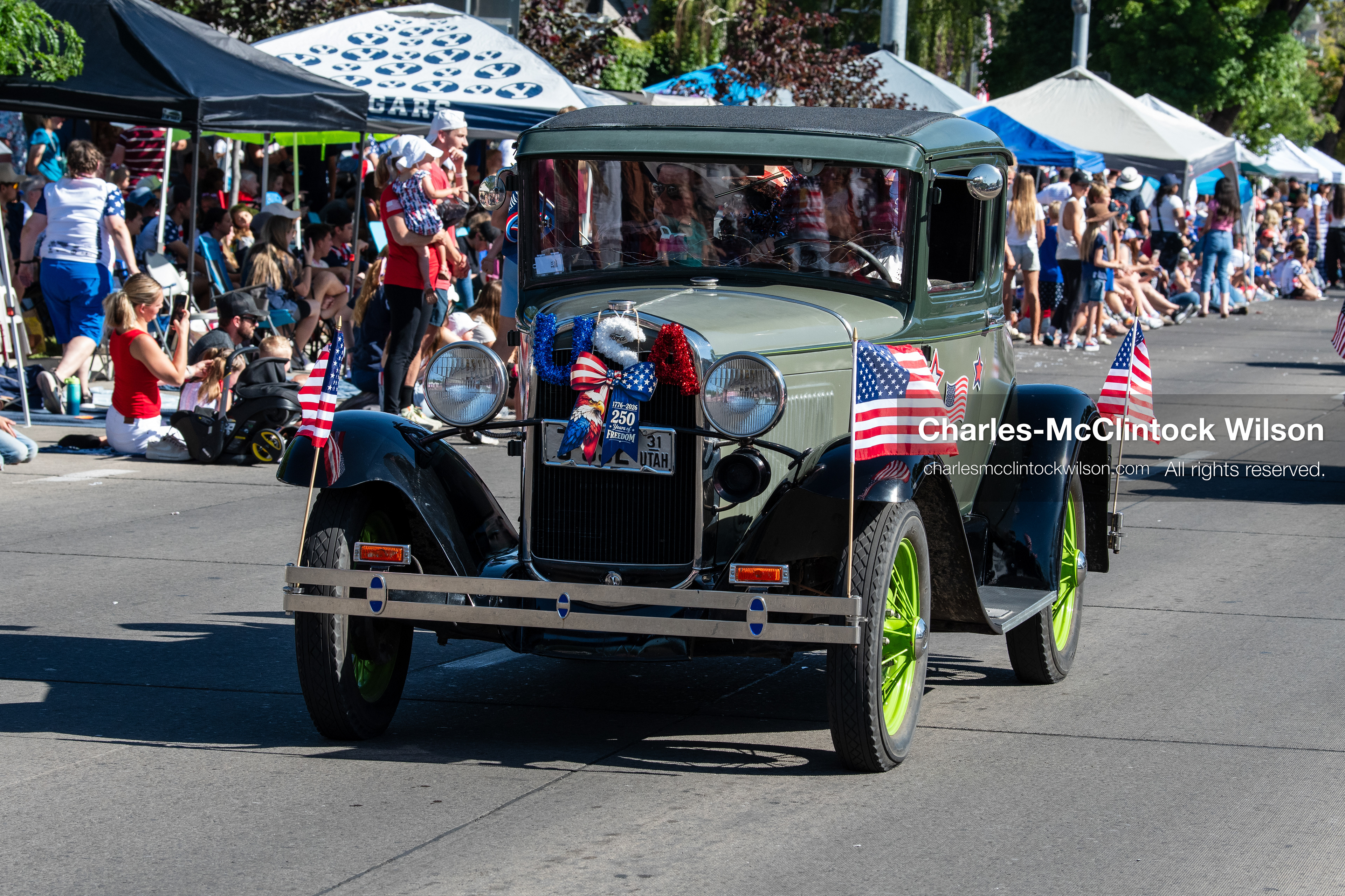 July 4, 2026, Provo, Utah, USA: A vintage classic car drives along University Avenue past crowds lining the street during America's Freedom Festival Grand Parade in Provo, Utah, Saturday, July 4, 2026. The annual event drew thousands of spectators to the downtown corridor. (Credit Image: © Charles-McClintock Wilson/ZUMA Press Wire)