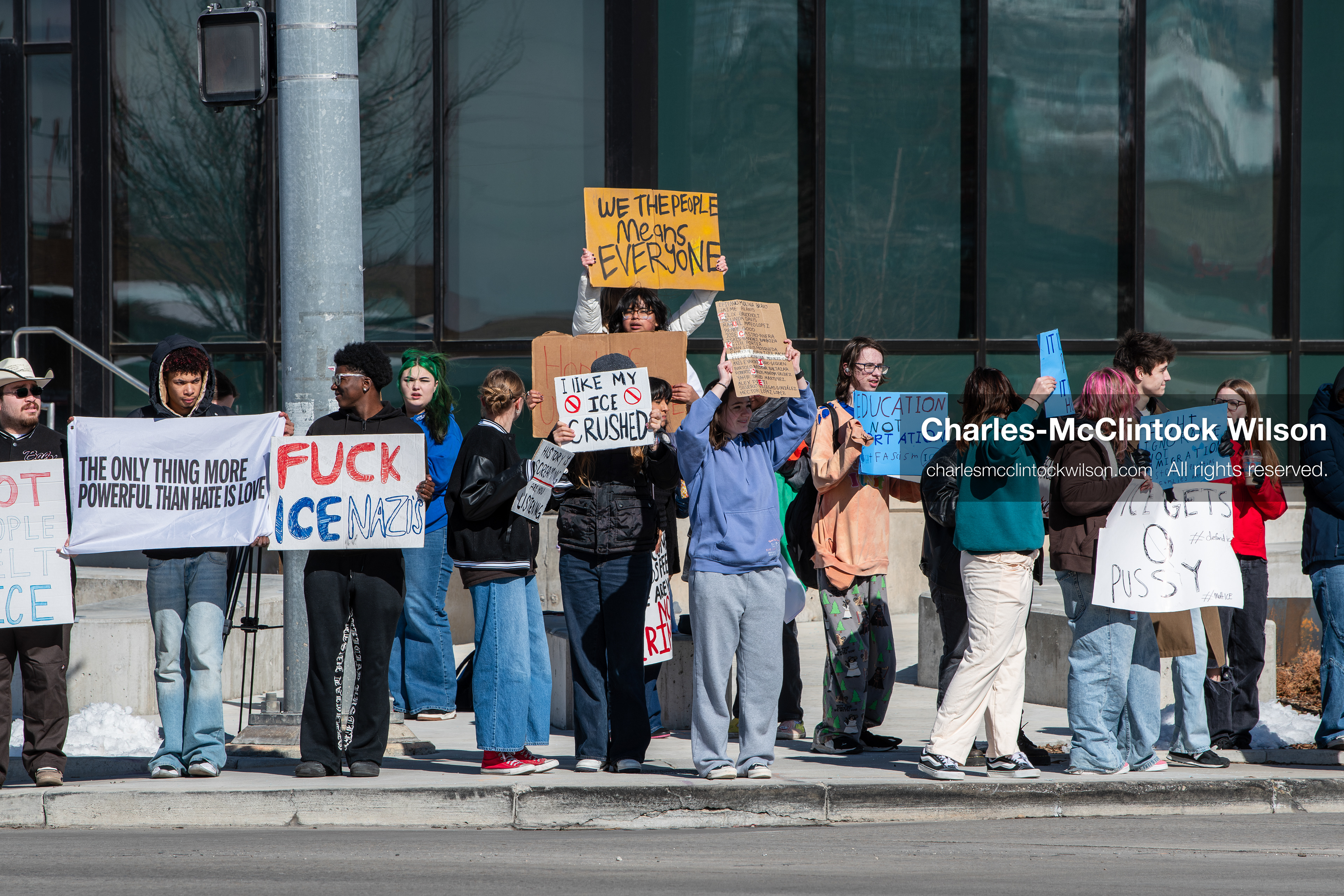 February 20, 2026, Orem, Utah, USA: High school students gather along State Street in front of Orem City Hall during a student led protest against ICE and federal immigration enforcement. Demonstrators hold signs as they stand near the roadway while traffic continues through the area. (Credit Image: © Charles McClintock Wilson/ZUMA Press Wire)