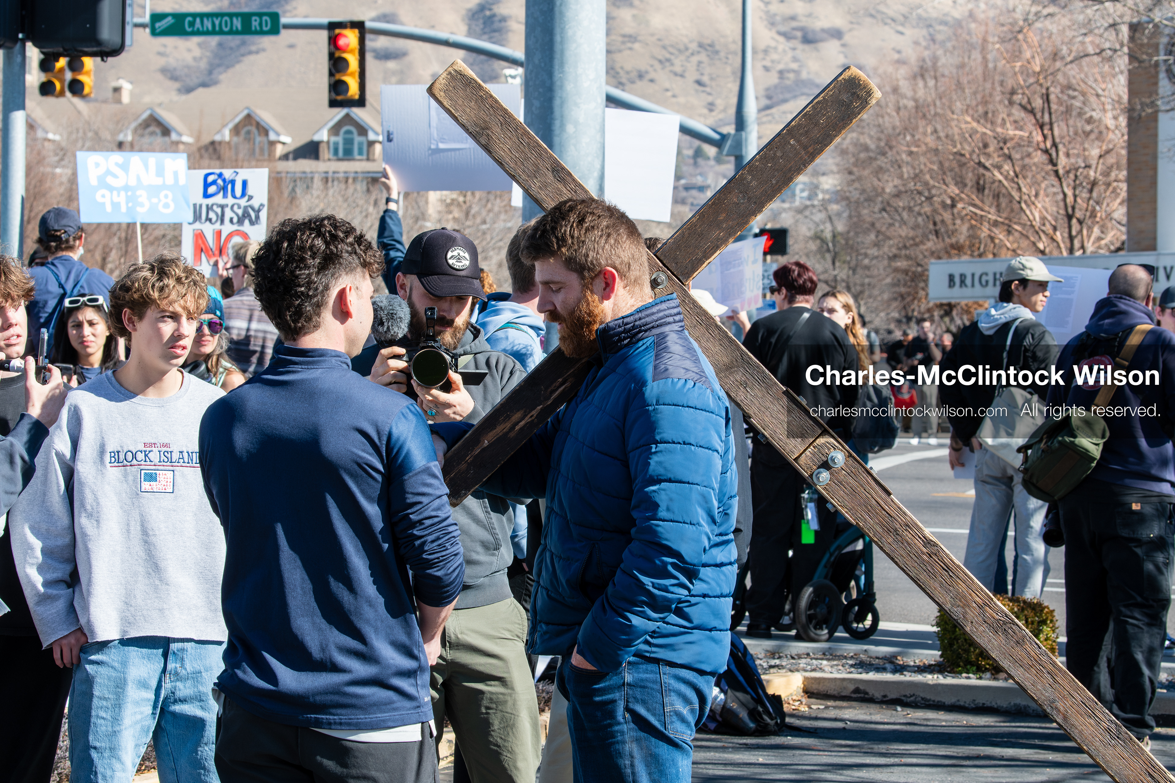 February 5, 2026, Provo, Utah, USA: A man carries a wooden cross while walking near Brigham Young University in Provo during a protest opposing the presence of US Customs and Border Protection recruiters at a career fair held on the BYU campus. (Credit Image: © Charles McClintock Wilson/ZUMA Press Wire)
