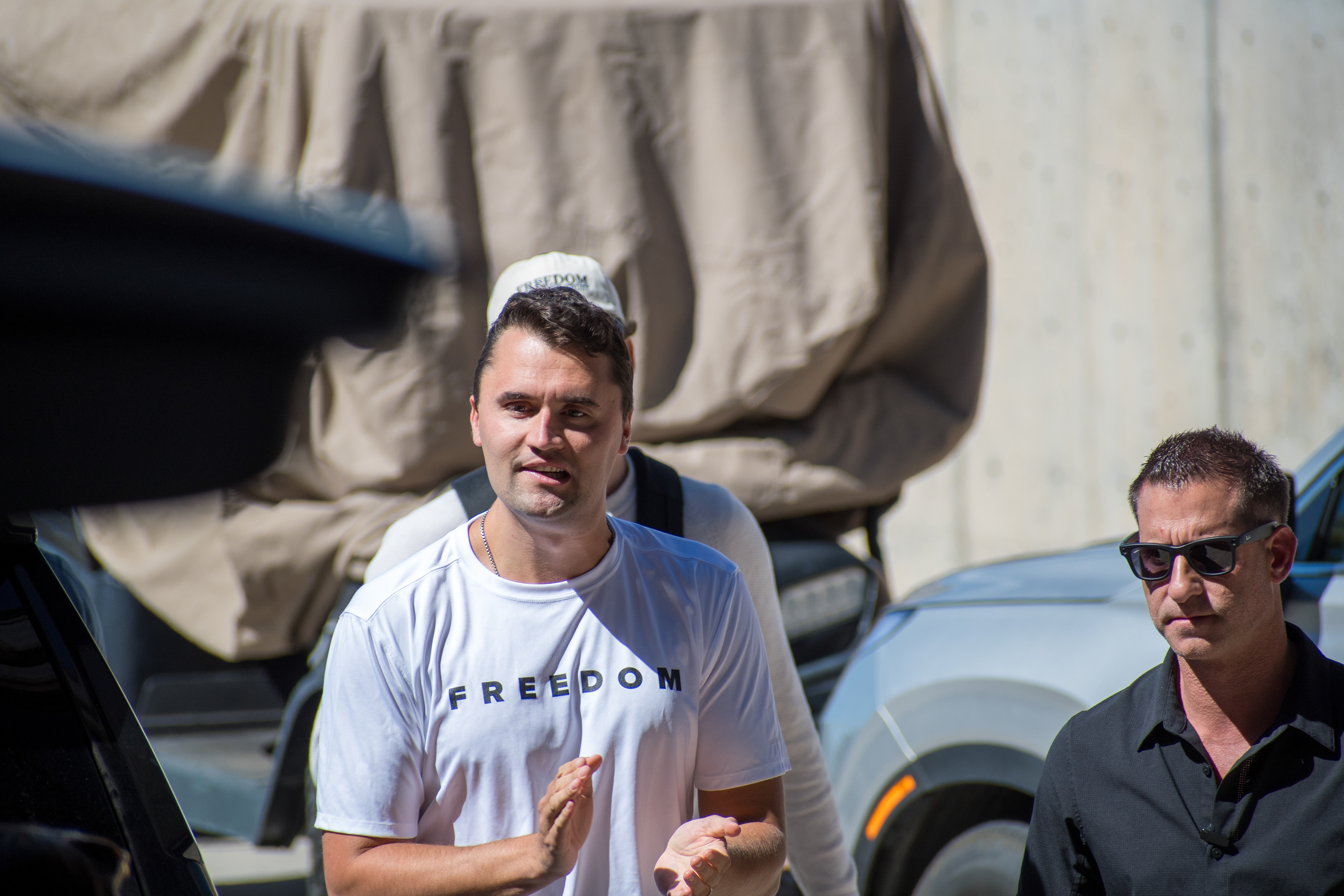 OREM, UTAH – SEPTEMBER 10, 2025: Charlie Kirk arrives at Utah Valley University for a scheduled public event. Wearing a shirt emblazoned with the word “FREEDOM,” Kirk walks among supporters and staff in a moment of visible anticipation. The image marks the beginning of his final public appearance, capturing the atmosphere of civic energy and symbolic presence that defined the day. © Charles-McClintock Wilson / ZUMA Press