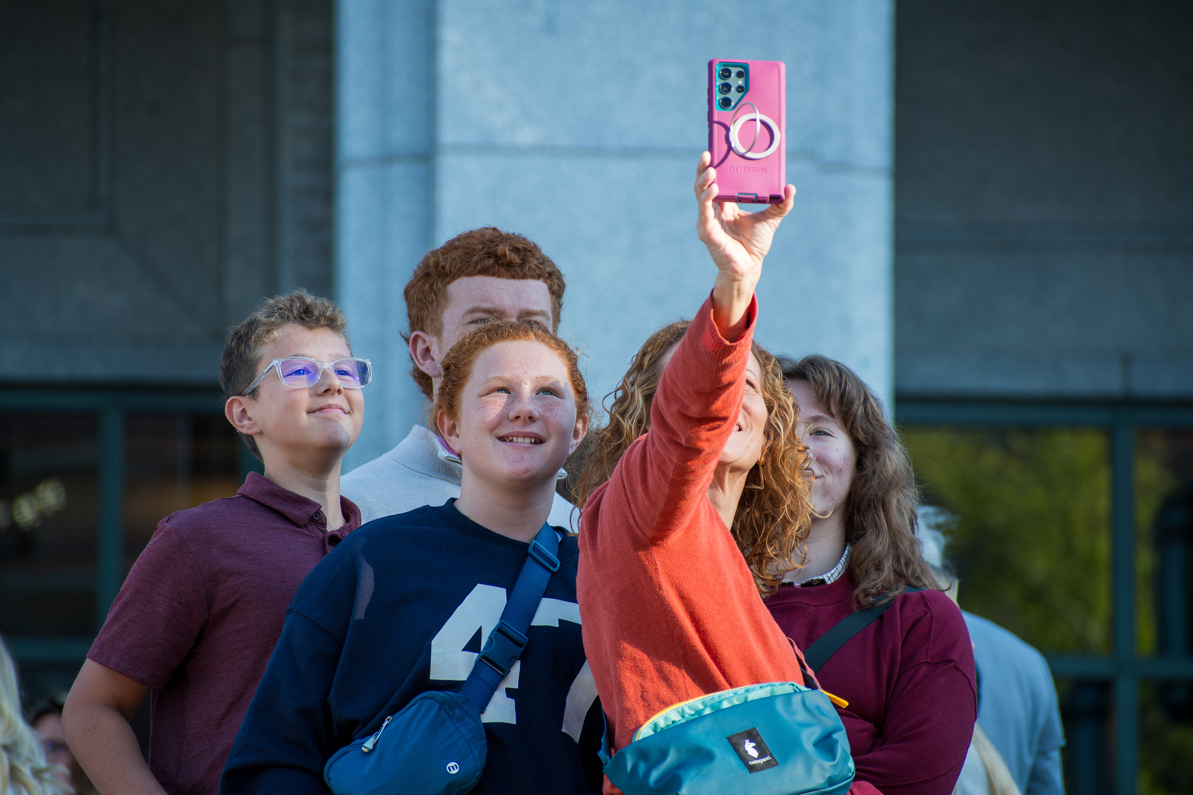 October 6, 2025, Salt Lake City, Utah, USA: A family takes selfies outside the Conference Center during the public viewing for Russell M. Nelson, the 17th president of the Church of Jesus Christ of Latter-day Saints. Nelson died at his home in Salt Lake City, Utah, on September 27, 2025, at the age of 101. (Credit Image: © Charles-McClintock Wilson/ZUMA Press Wire)