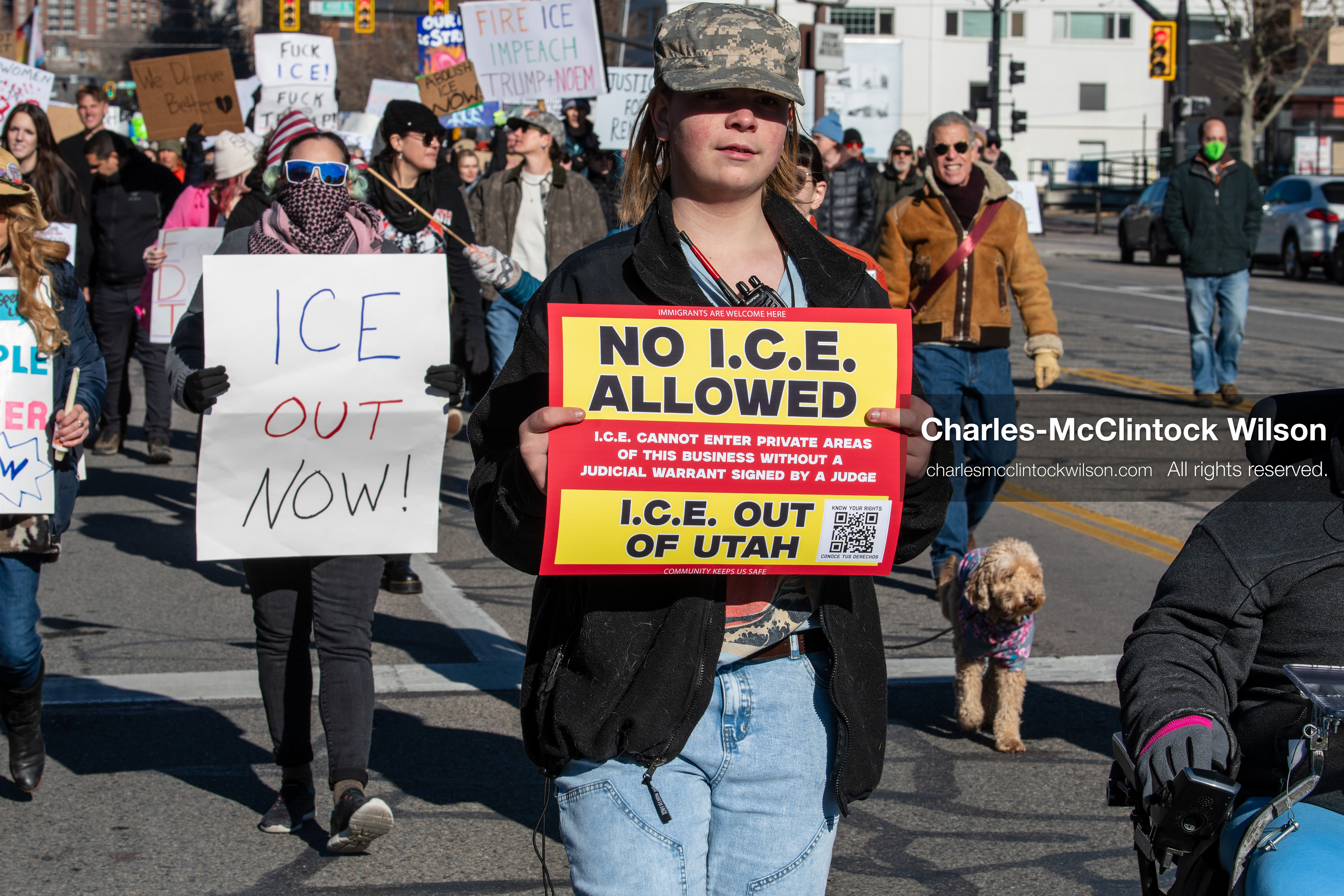 Salt Lake City, Utah, January 10, 2026: A group of demonstrators marches through downtown Salt Lake City during the ICE Out for Good protest, which began at Washington Square Park, with participants carrying signs and personal items as they walk together. (Credit Image: © Charles‑McClintock Wilson/ZUMA Press Wire)