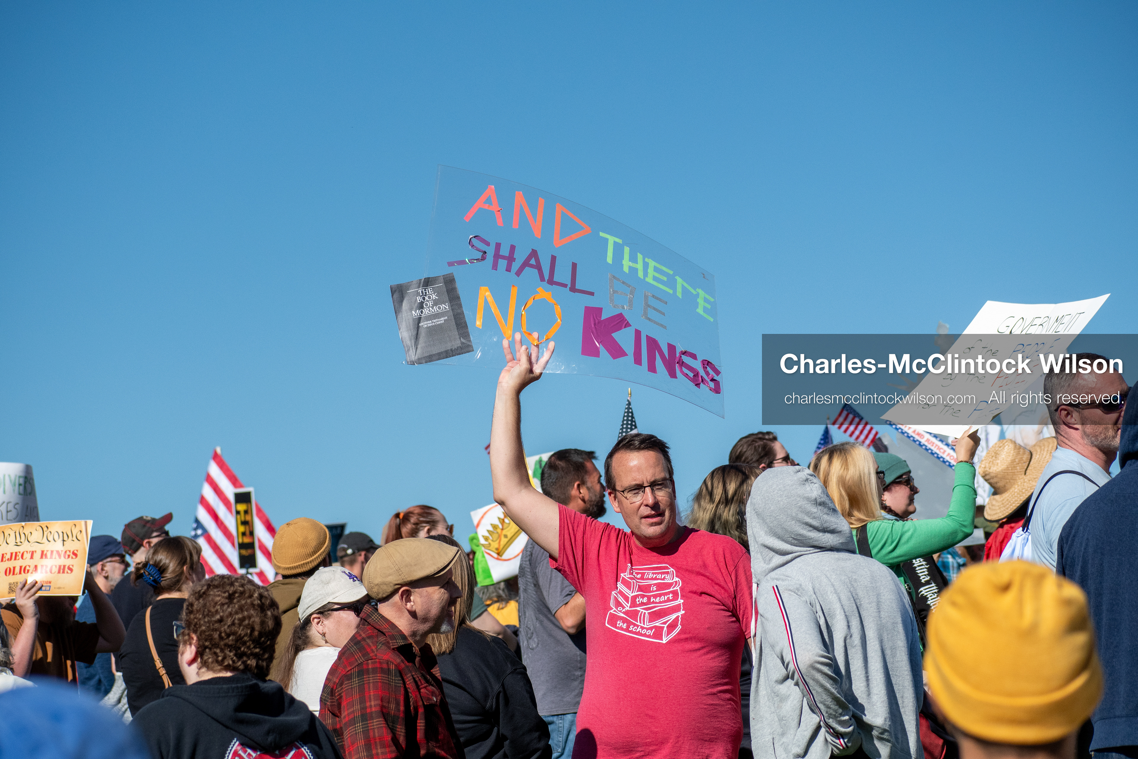 October 18, 2025, Salt Lake City, Utah, USA: Demonstrators gather on the steps of the Utah State Capitol during a "No Kings" protest held as part of a nationwide mobilization. Participants hold signs and flags while documenting the event. The protest was one of several organized across the United States.