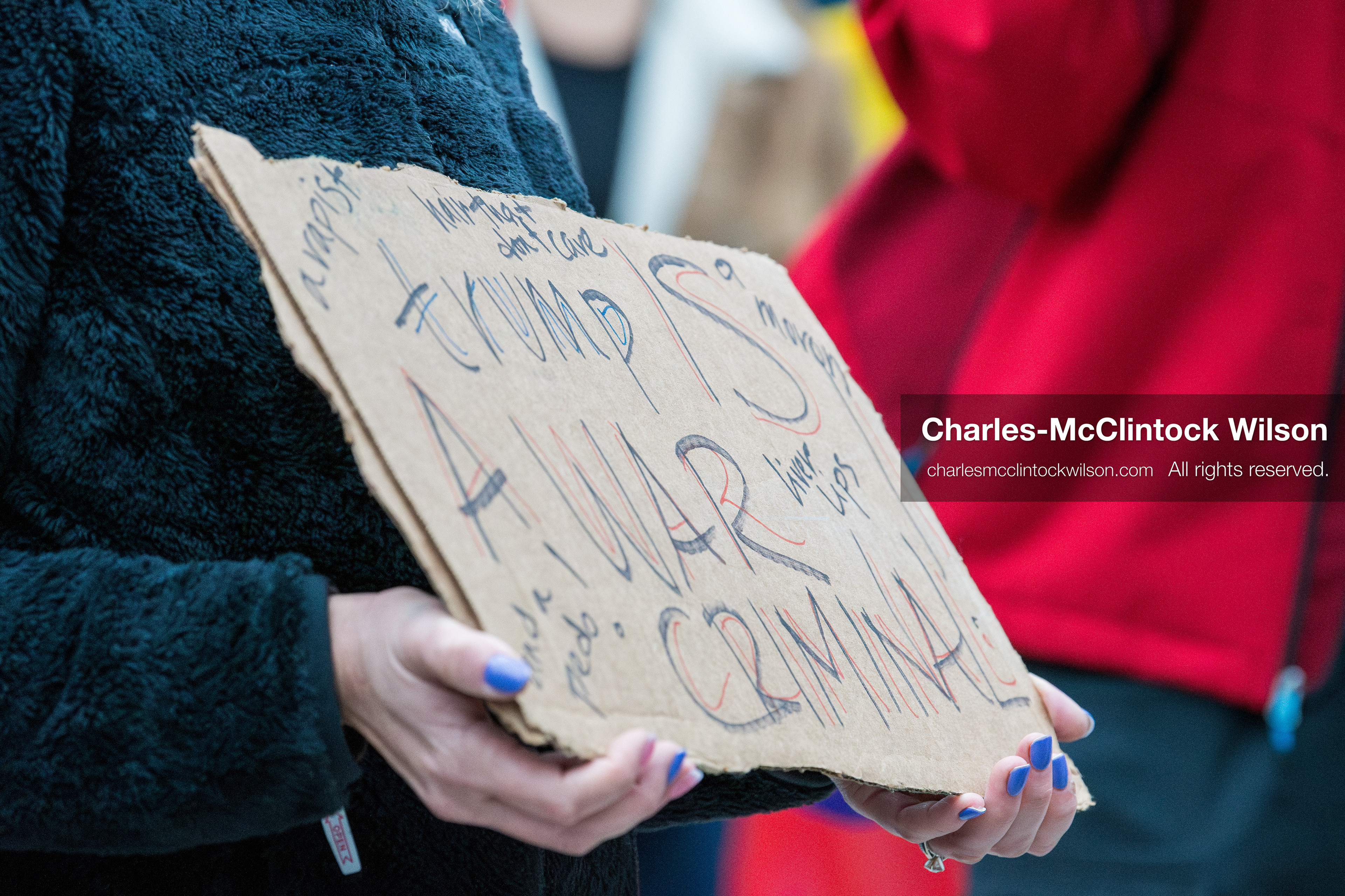January 3, 2026, Salt Lake City, Utah, USA: A protester holds a sign during a demonstration against US action in Venezuela outside the Wallace Federal Building in Salt Lake City, Utah. The protest was part of a nationwide mobilization responding to recent military developments. (Credit Image: (c) Charles‑McClintock Wilson/ZUMA Press Wire)