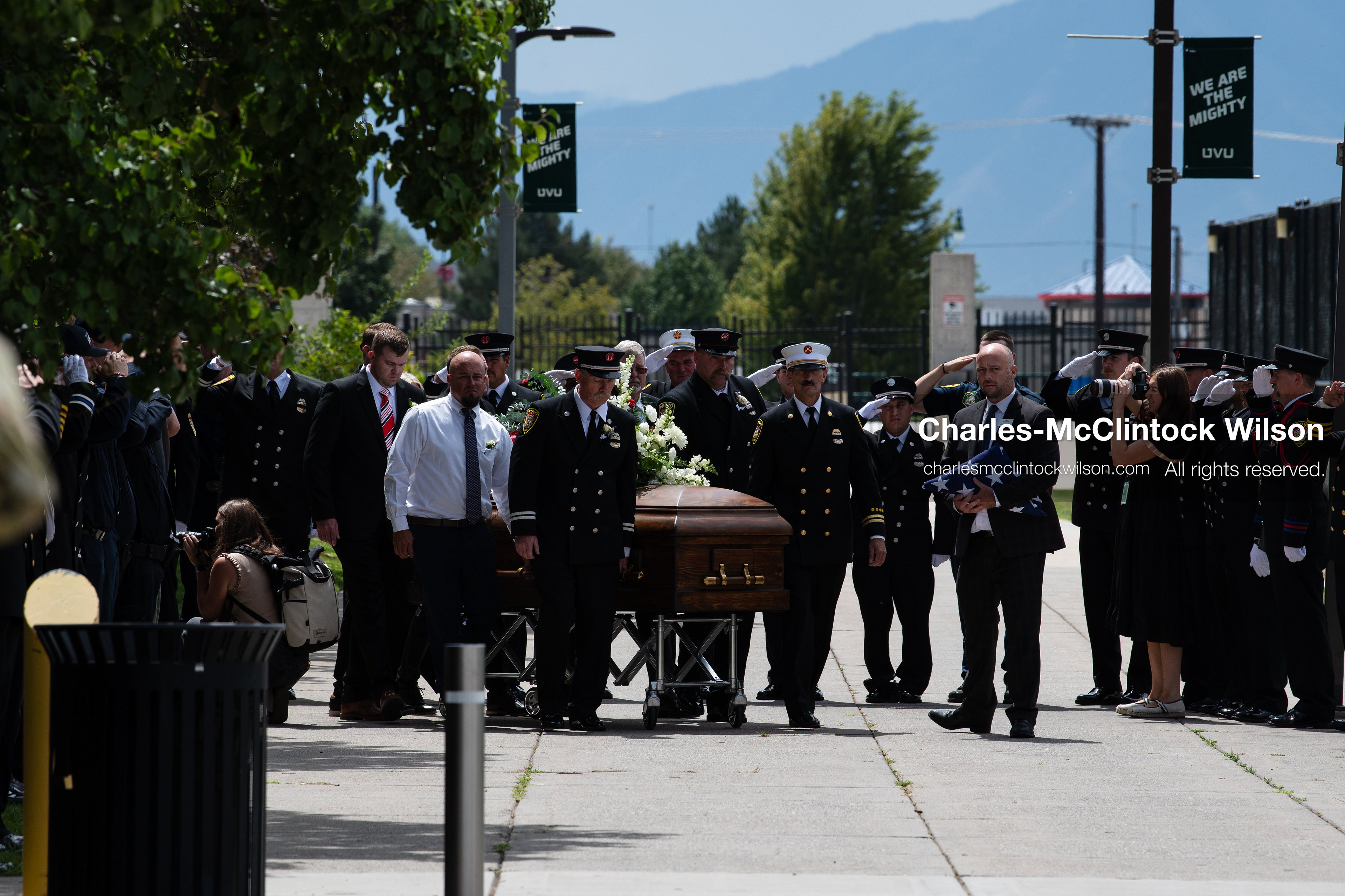 Firefighters and pallbearers escort the casket of Provo Fire Captain Spencer Long outside the UCCU Center on the campus of Utah Valley University in Orem, Utah, on Wednesday, July 29, 2026. More than 300 people came to the public memorial ceremony to honor Captain Long, his wife Katrina, and three of their sons, who died after a flash flood hit their campsite near the Sunglow Campground in Wayne County. (Photo by Charles-McClintock Wilson/Sipa USA)