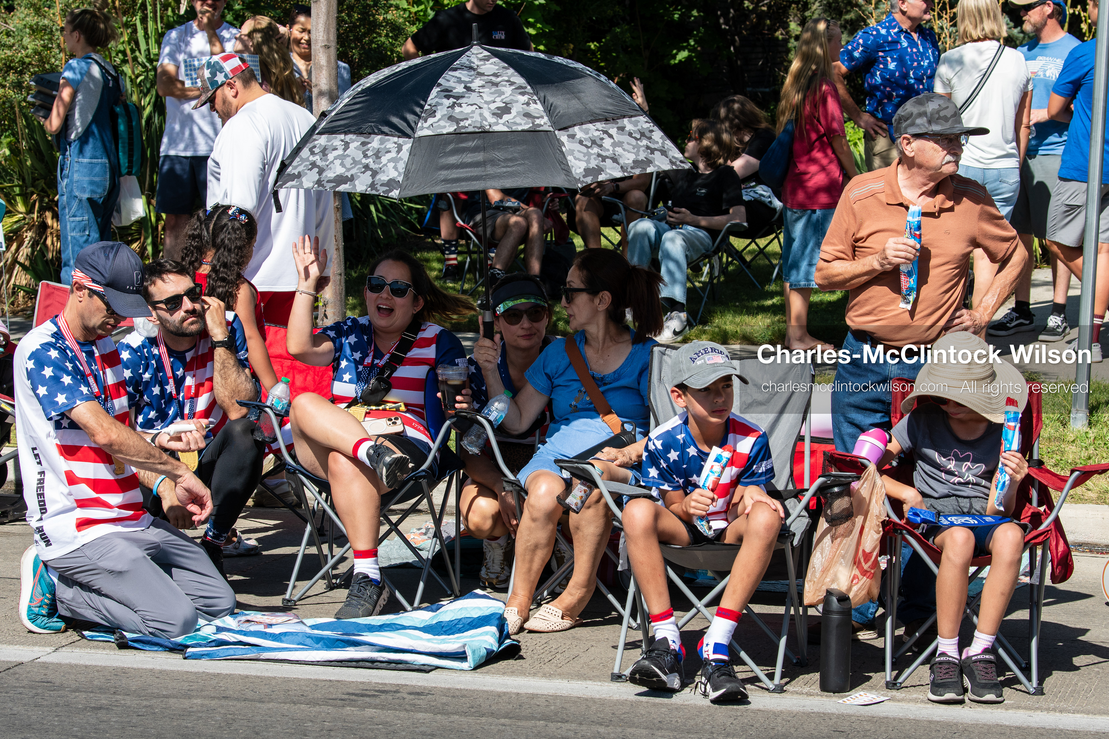  July 4, 2026, Provo, Utah, USA: Spectators wearing patriotic stars and stripes attire sit in lawn chairs along the sidewalk to watch America's Freedom Festival Grand Parade in Provo, Utah, Saturday, July 4, 2026. The annual Independence Day event features expanded programming to honor the 250th anniversary of United States independence. (Credit Image: © Charles-McClintock Wilson/ZUMA Press Wire)