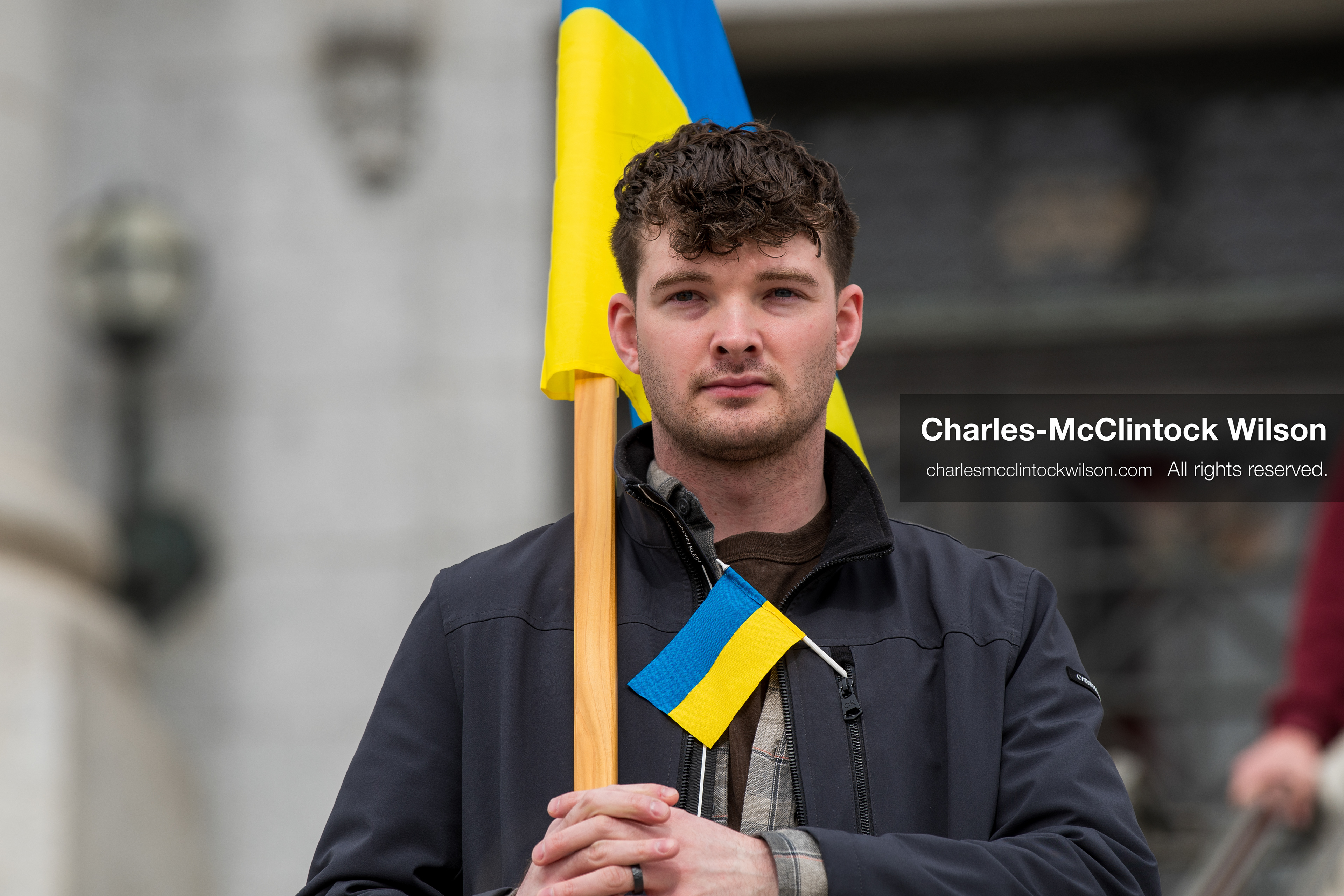 February 28, 2026, Salt Lake City, Utah, USA: A demonstrator stands near the Utah State Capitol holding a Ukrainian flag during the Stand With Ukraine rally. The gathering marked the four year anniversary of the full scale Russian invasion of Ukraine and brought community members together in support of Ukrainians and local humanitarian efforts. (Credit Image: © Charles McClintock Wilson/ZUMA Press Wire)